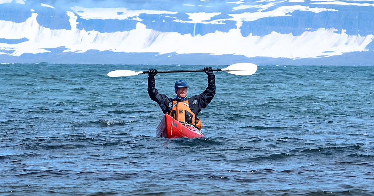 Kayakers departing from Ísafjörður for a multi-day Westfjords sea-kayaking trip around Ísafjarðardjúp.