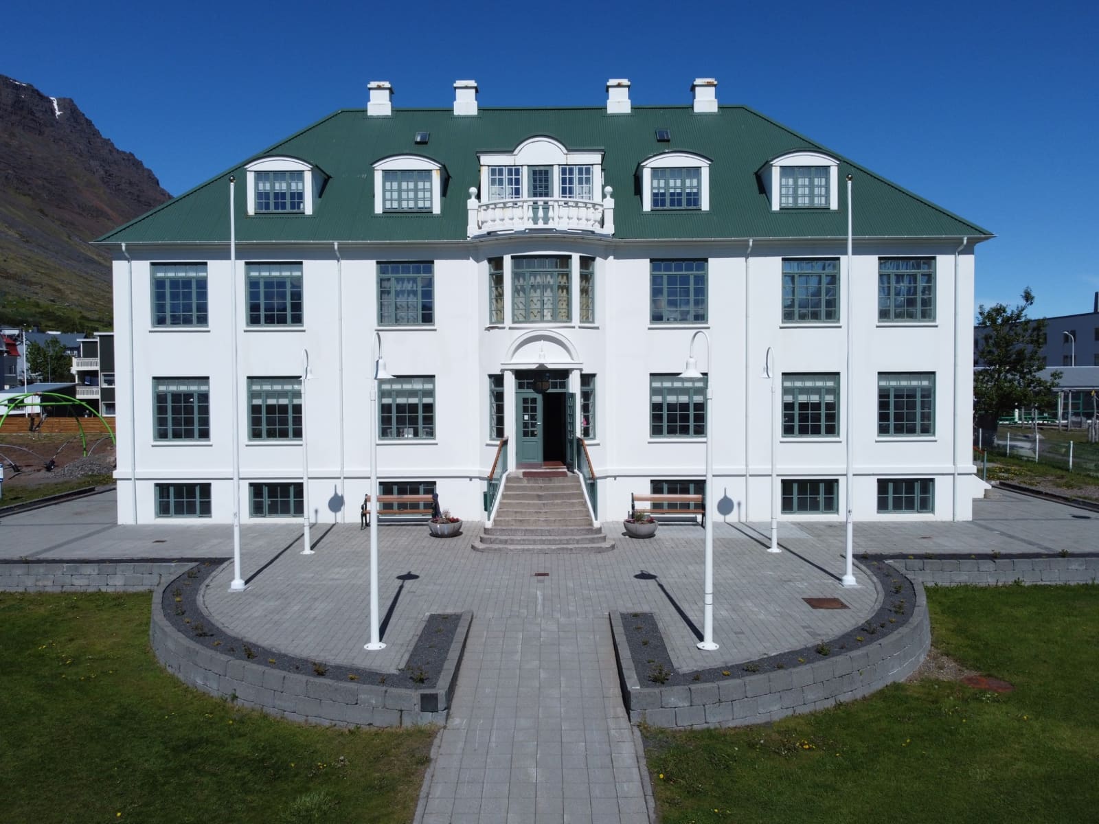 Ísafjörður Culture House seen from the front with its green roof and formal entrance.