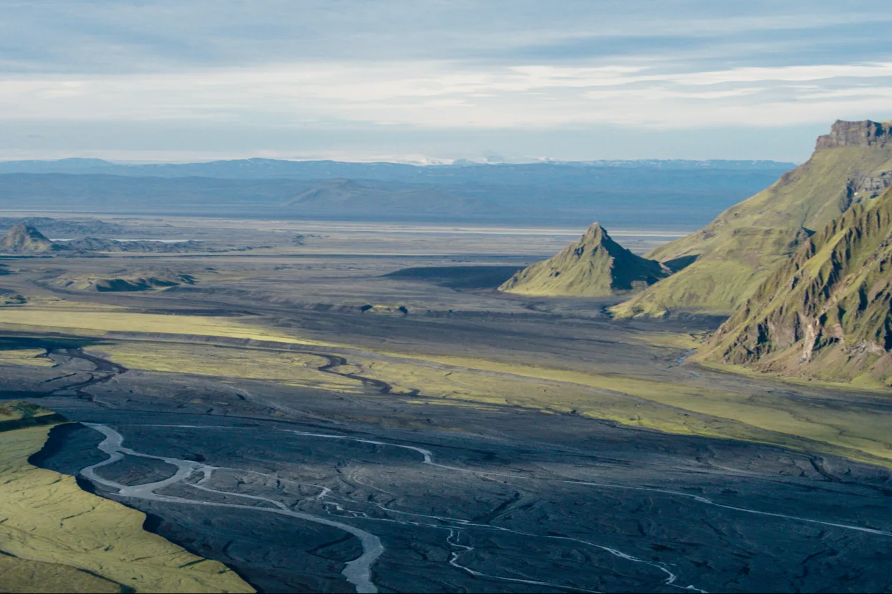 Mýrdalssandur black-sand outwash plain below mountains in Katla Geopark