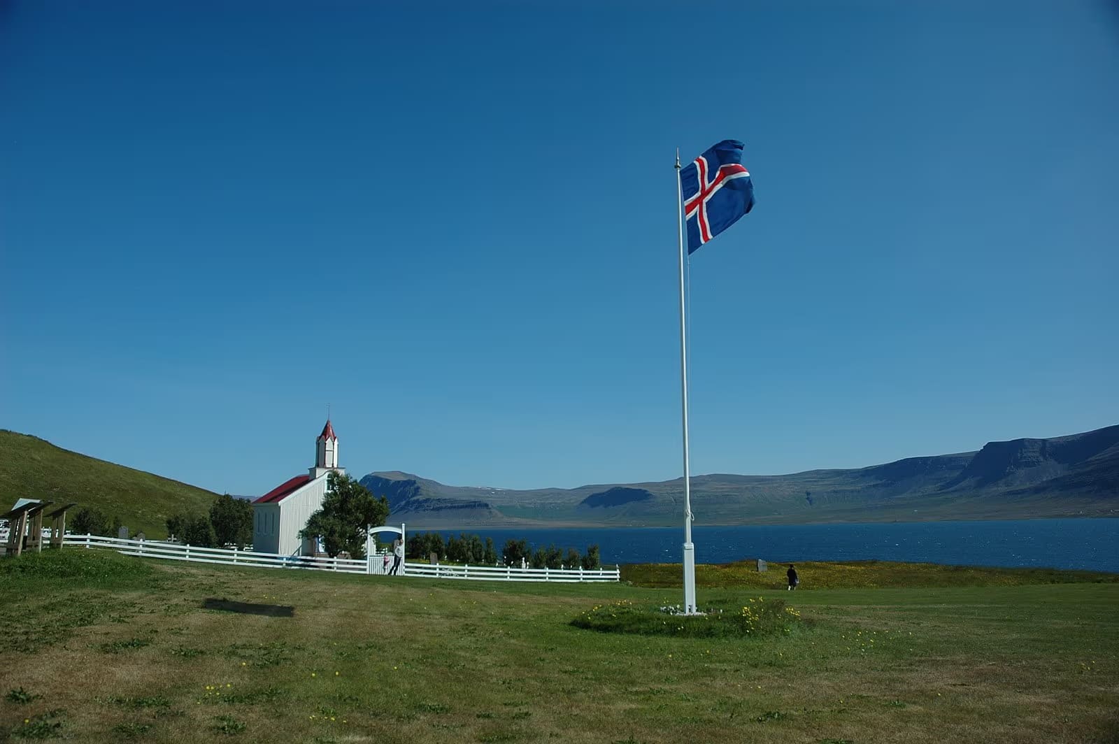 Hrafnseyri church and flag beside Arnarfjörður in the Westfjords.