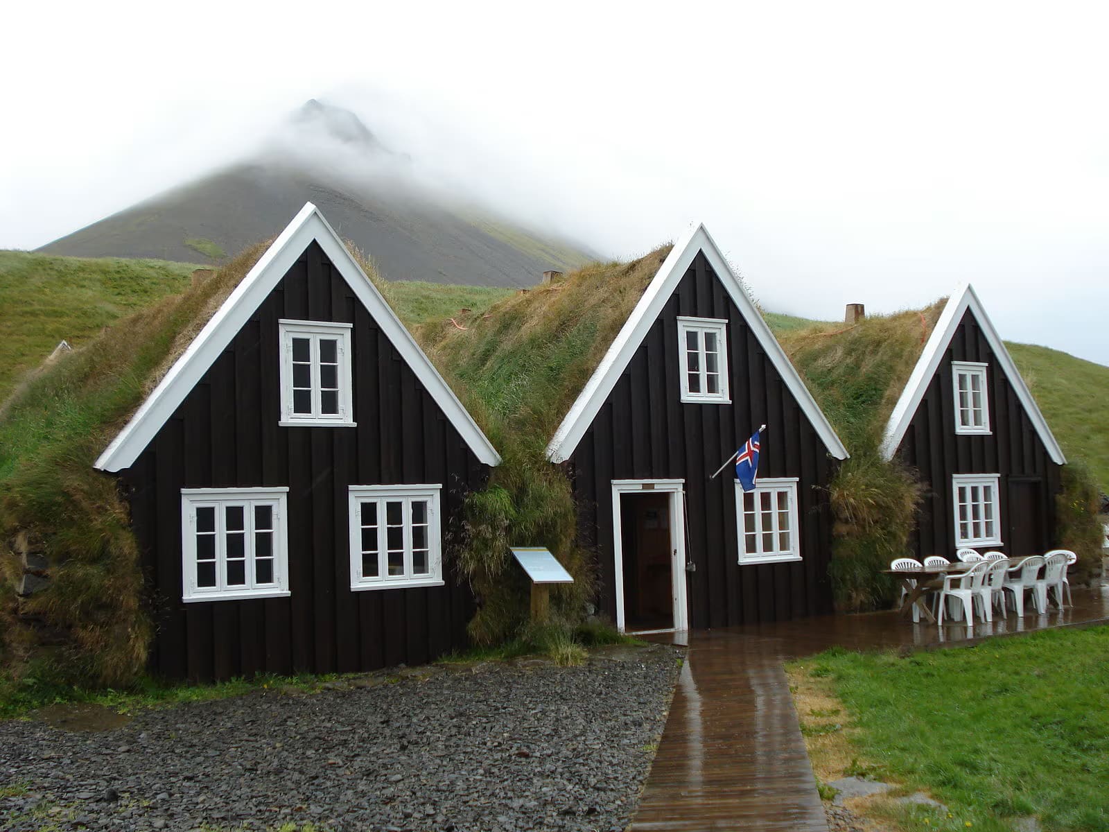 Black turf-style buildings at Hrafnseyri in the Westfjords.