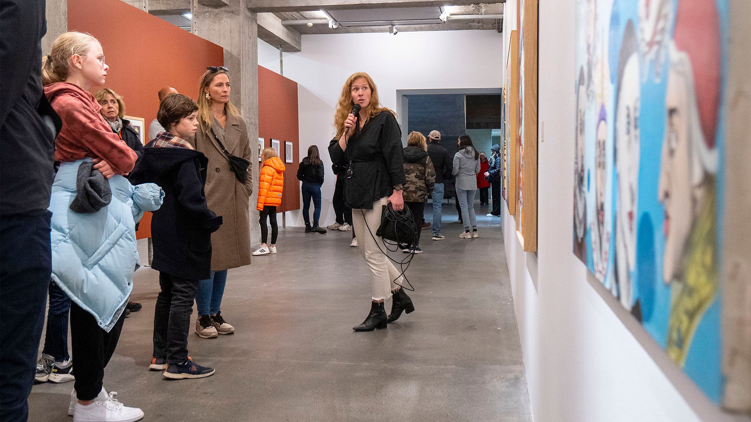 A guide speaking to visitors during an exhibition at Kjarvalsstaðir