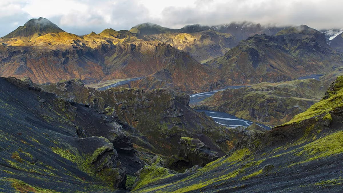 Dark Kristnitökuhraun lava ridges and mossy slopes on Hellisheiði.