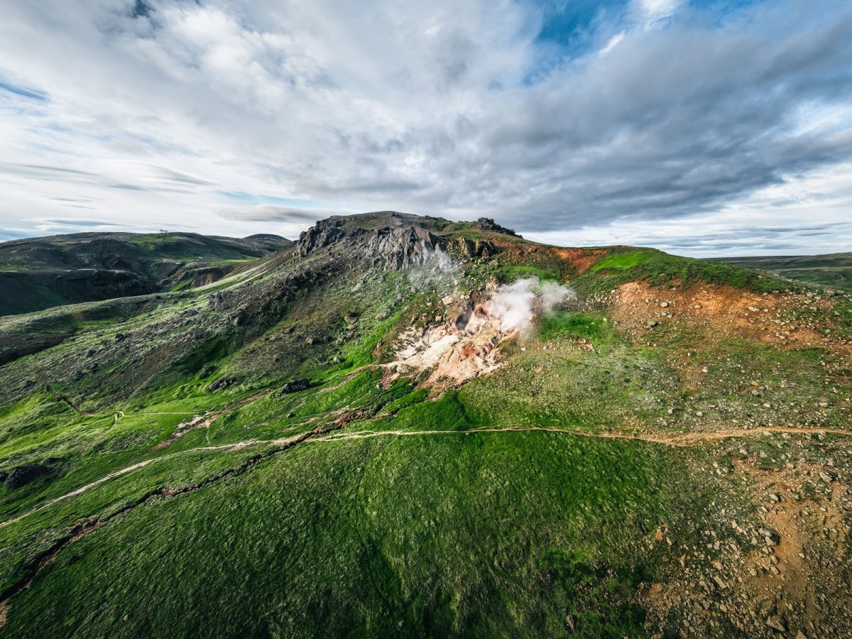 Geothermal slopes and green mountains in the Hengill area of South Iceland.