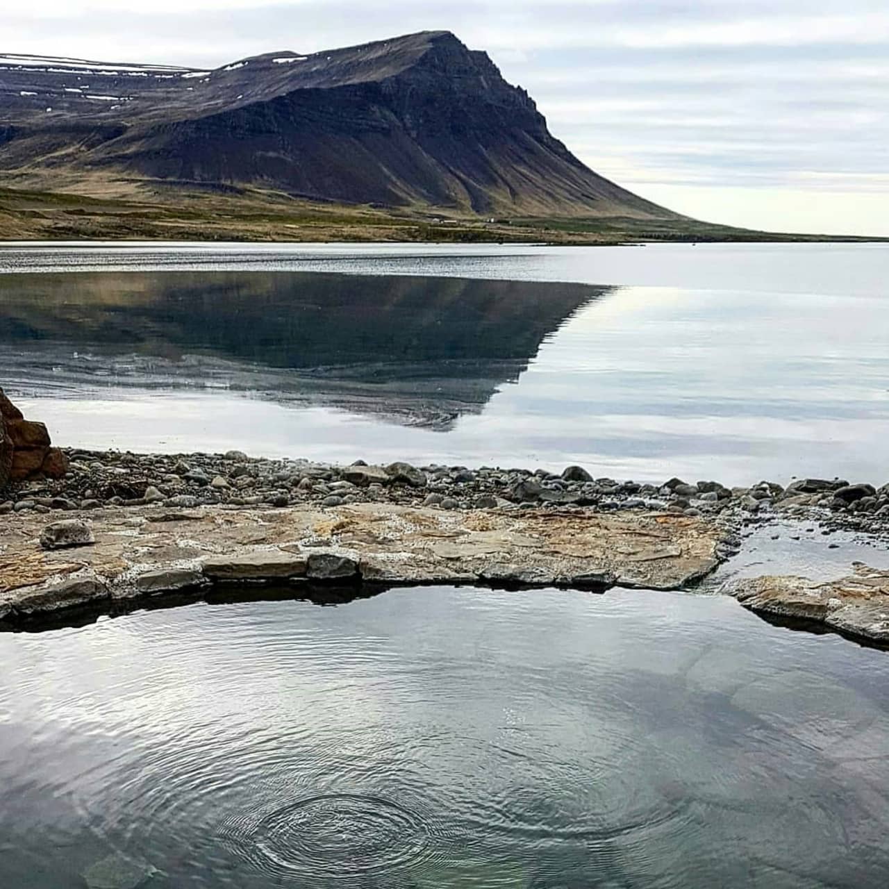 Krosslaug hot spring site at Laugarnes with a compact pool setting.