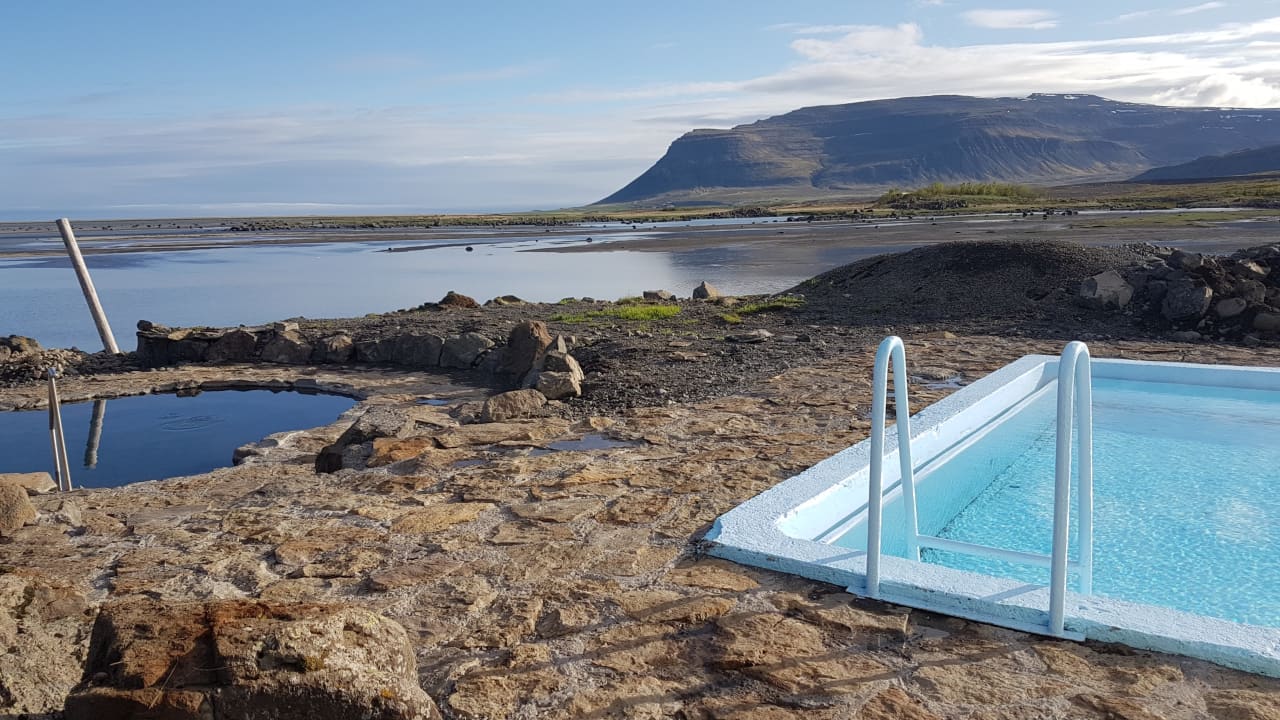 Krosslaug at Laugarnes on Barðaströnd with the pool area below the road.