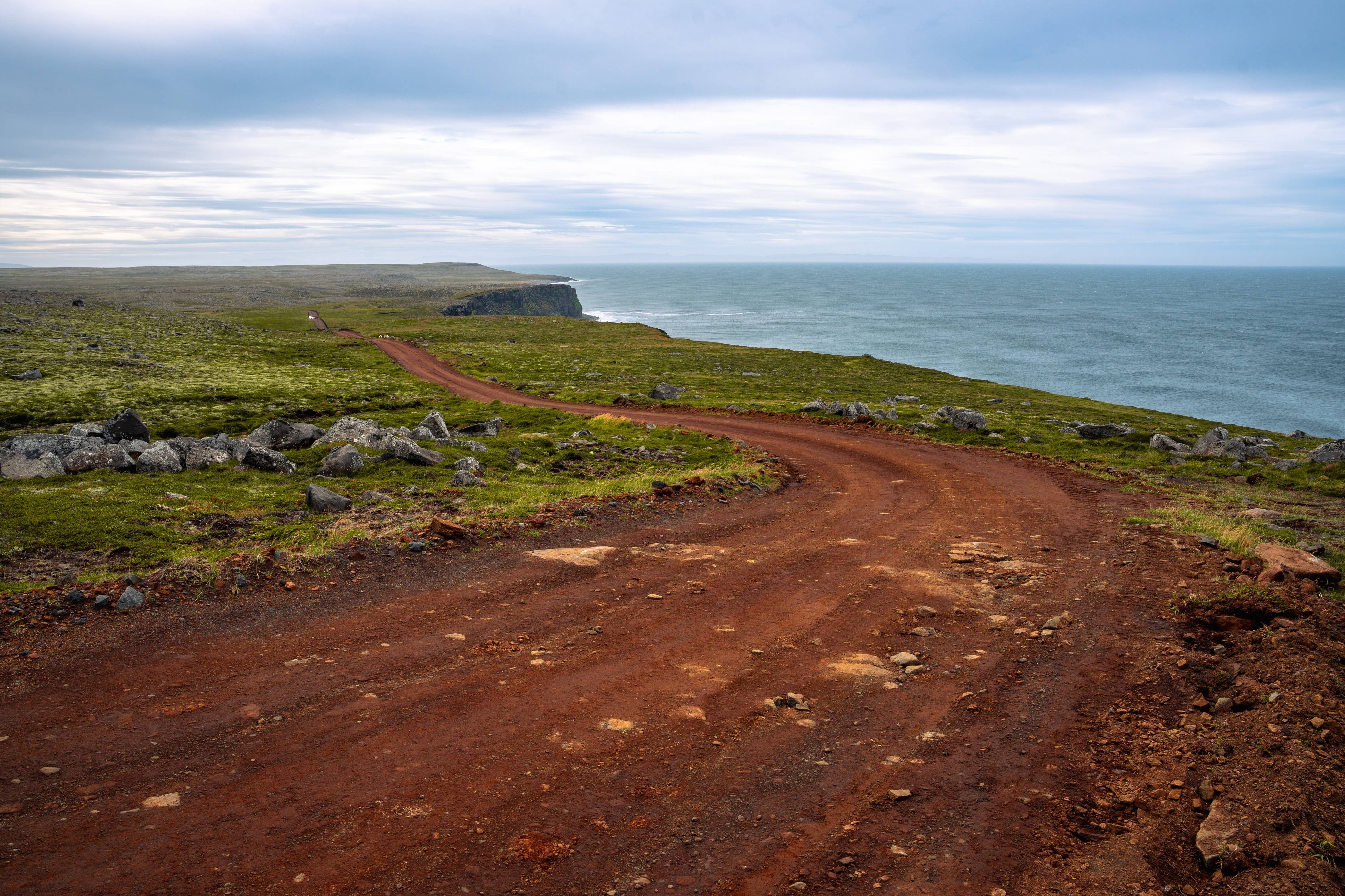 A remote road crossing open ground on the Langanes Peninsula.