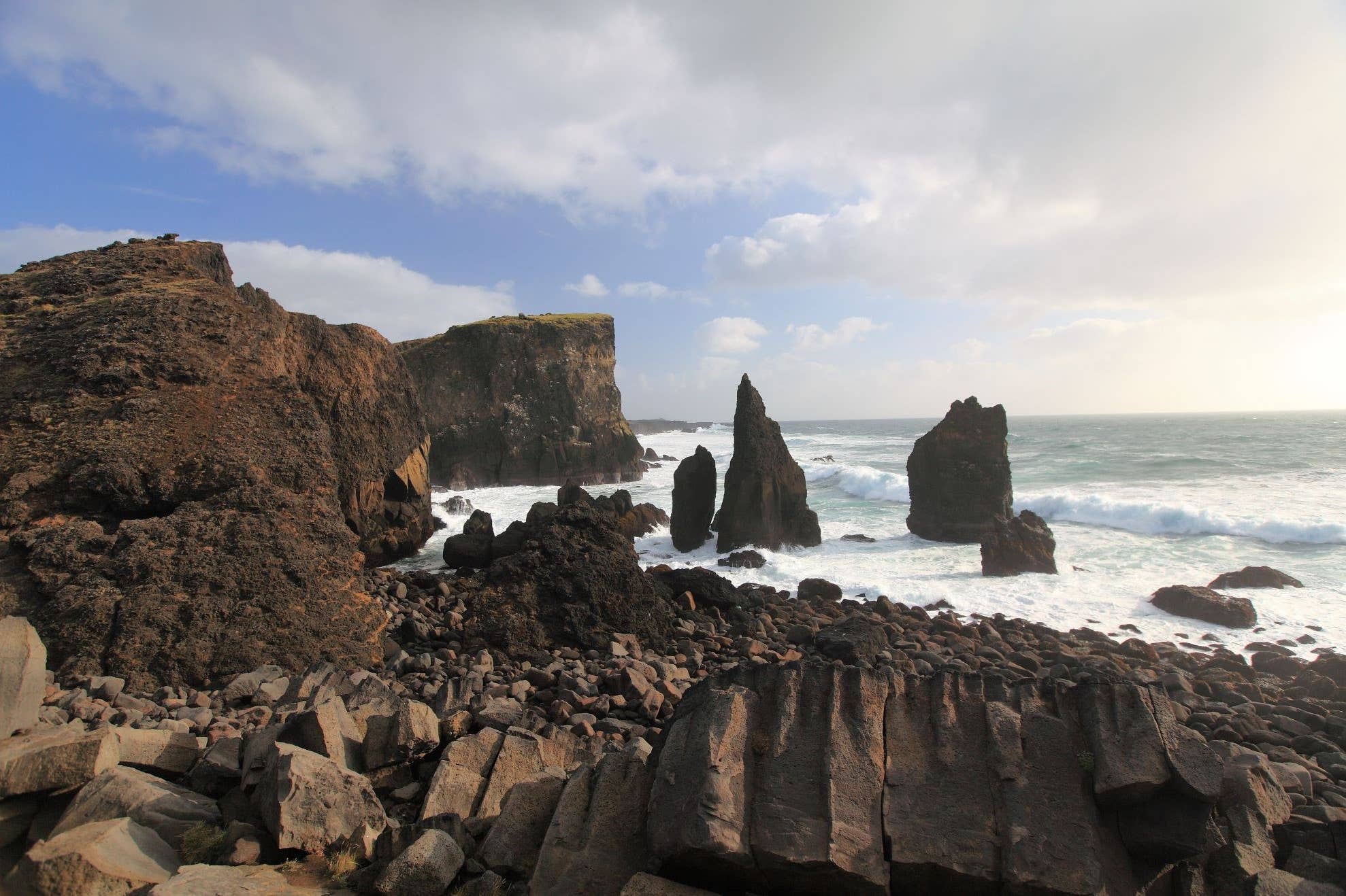Dark volcanic rock formations on the Reykjanes Peninsula.