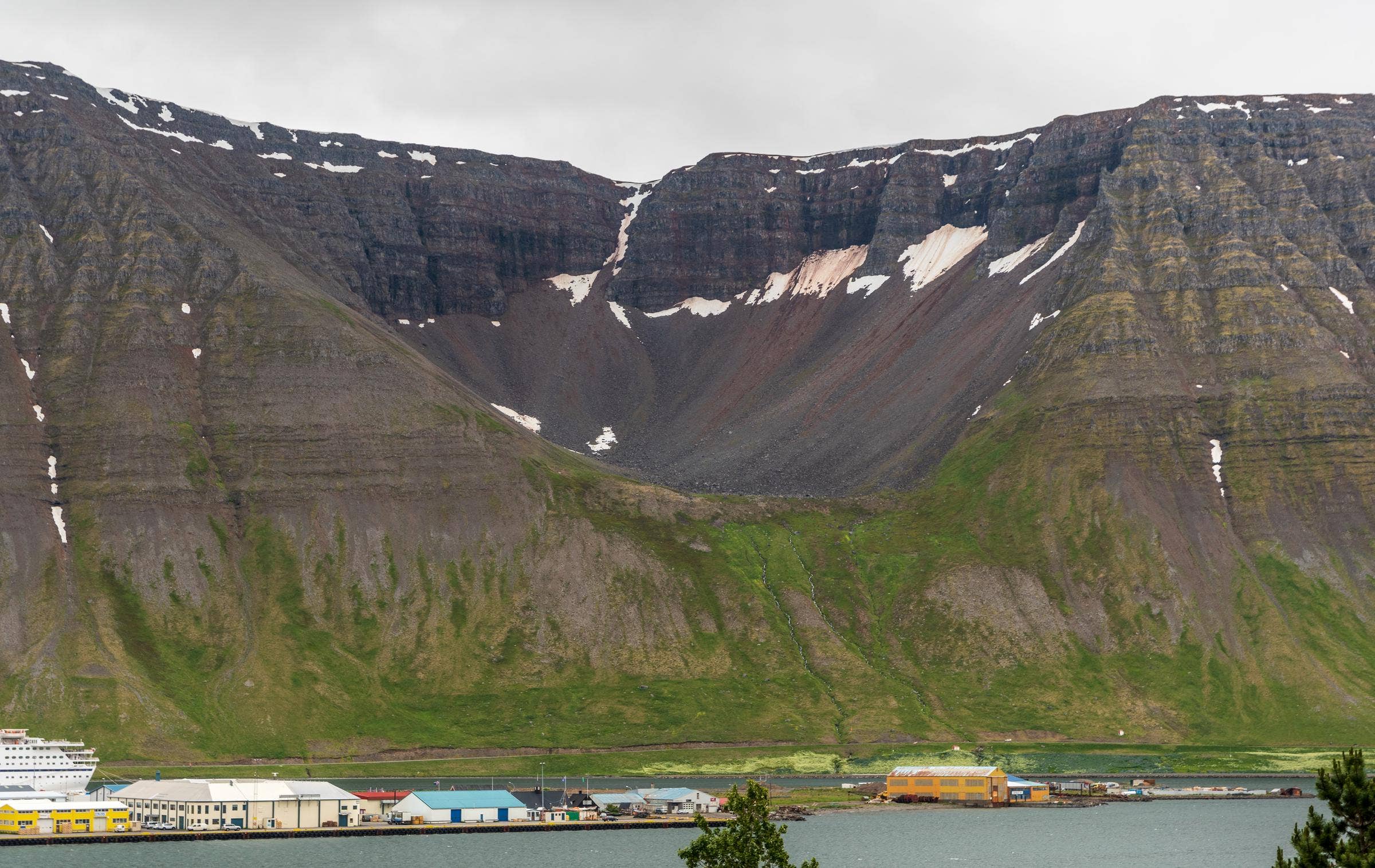Naustahvilft above the Ísafjörður harbor and Skutulsfjörður waterfront in the Westfjords.