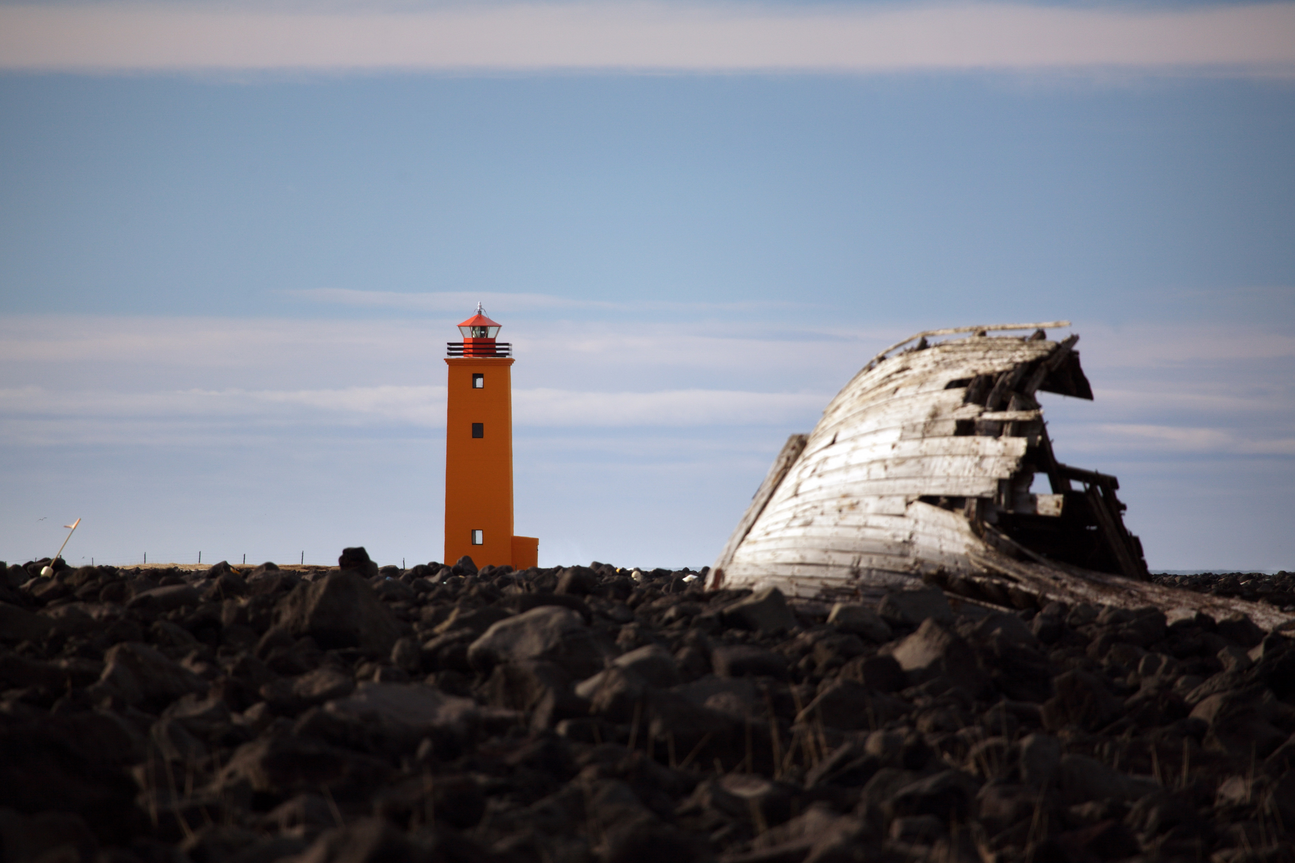 Selvogsviti lighthouse and a shipwreck on the western coast of Ölfus
