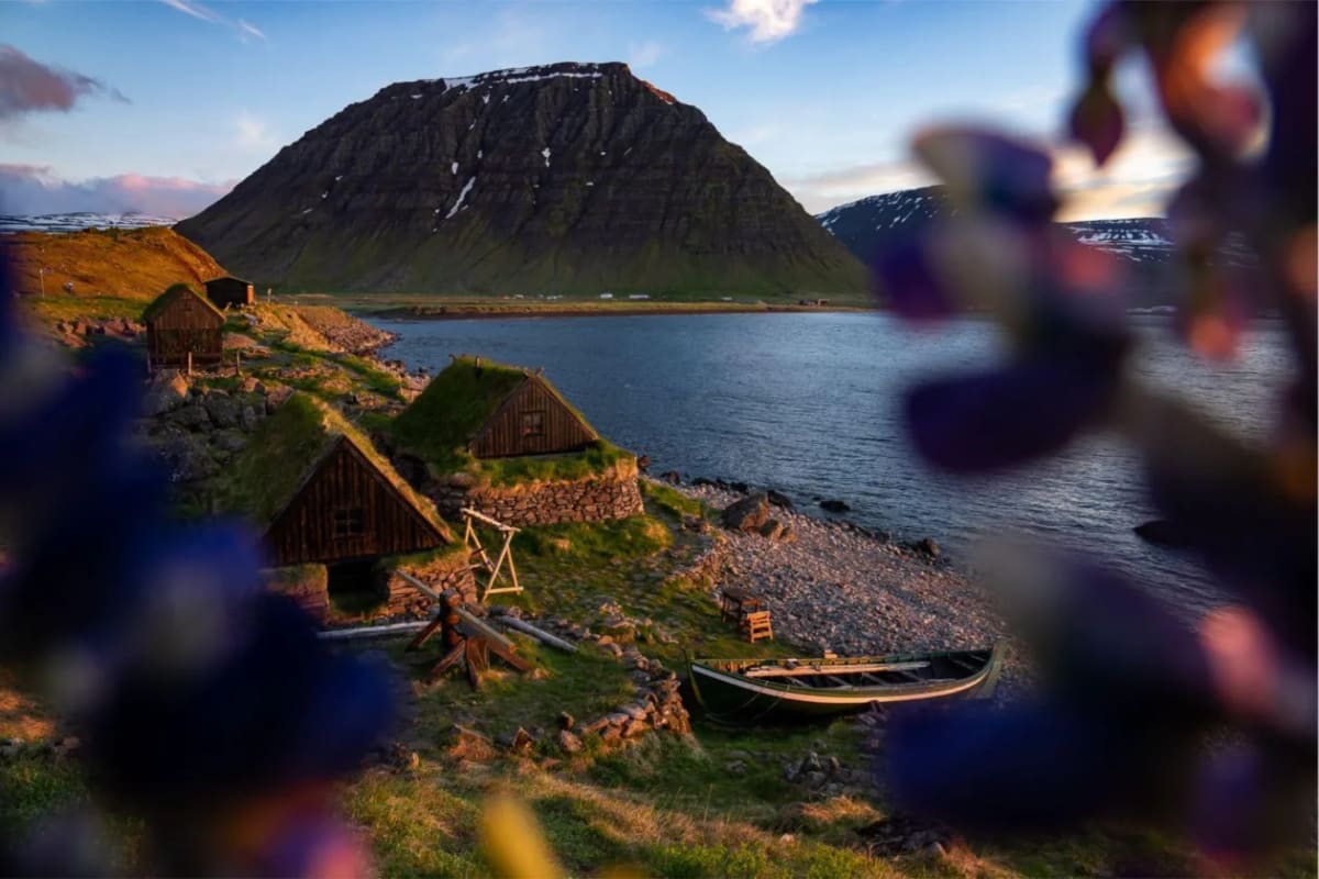 Ósvör Maritime Museum buildings below the mountains outside Bolungarvík.
