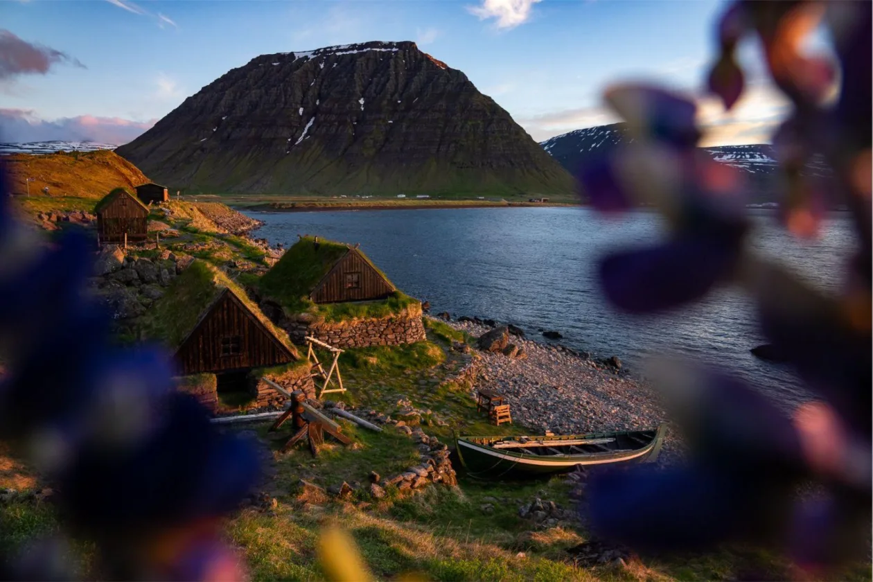 Ósvör Maritime Museum buildings below the mountains outside Bolungarvík.