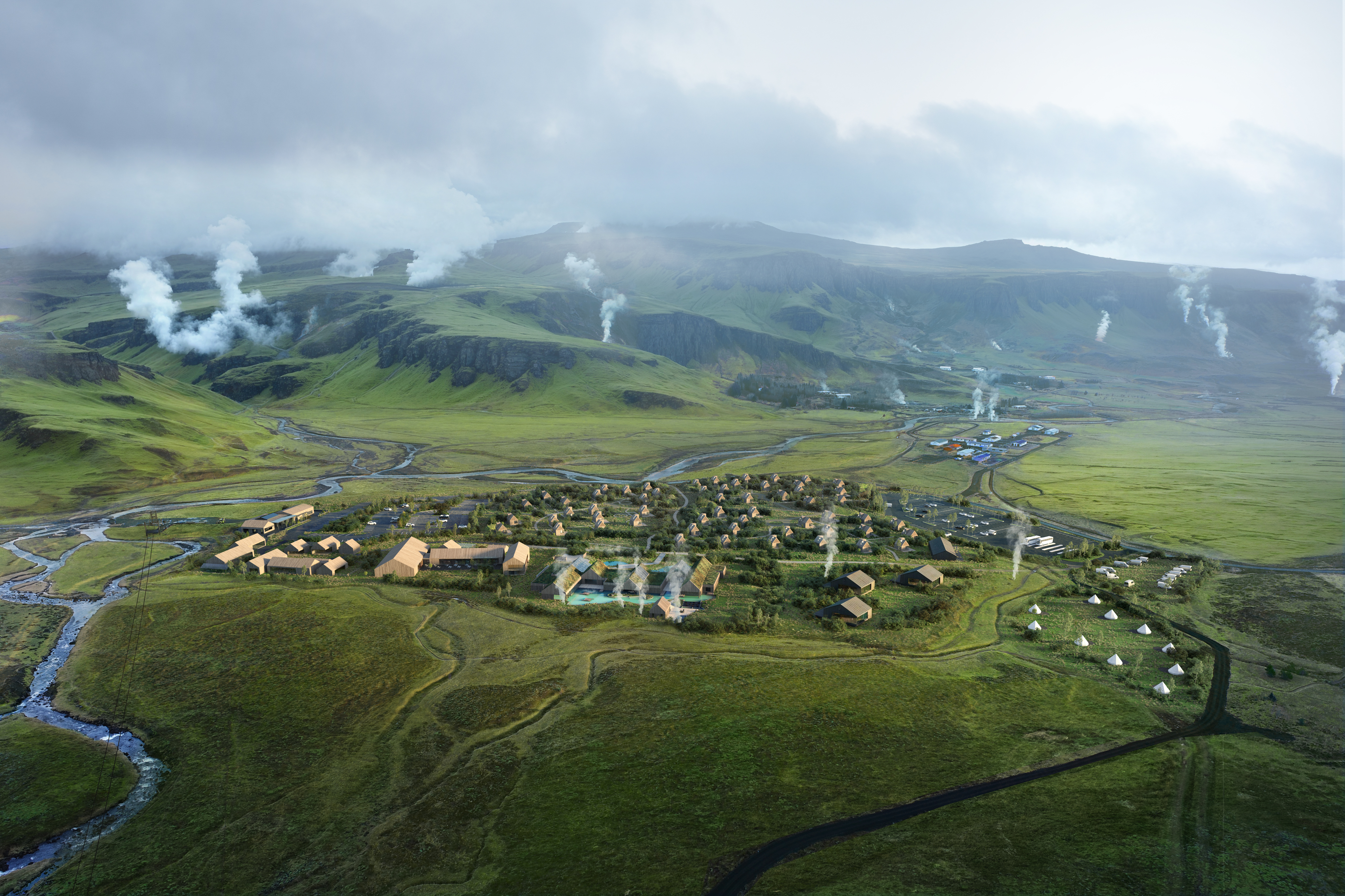 Aerial view of Hveragerði, Reykjadalur, and geothermal steam around the Reykjaböð Hot Springs area.