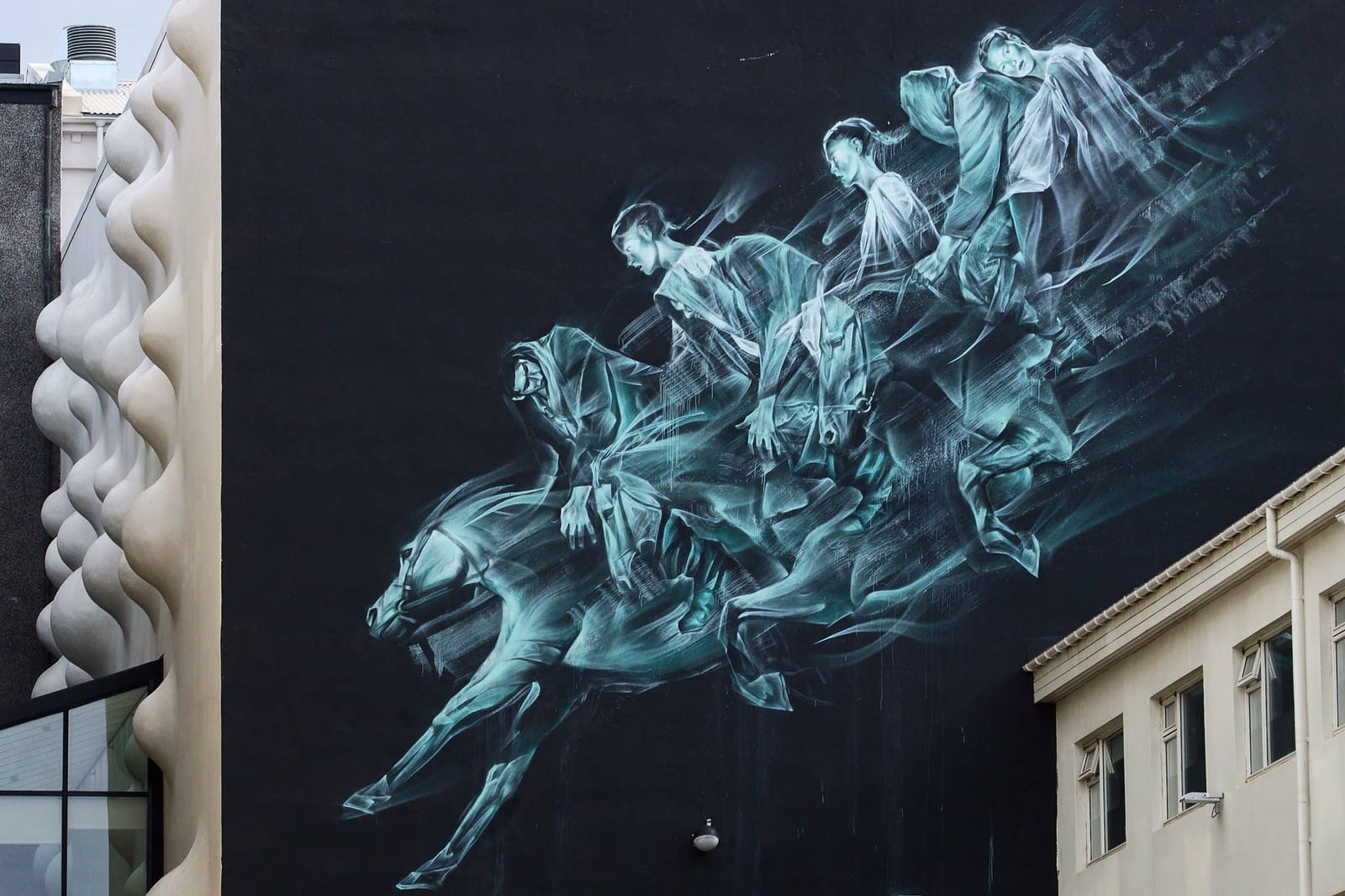 Horses in the Night mural painted on a wall in Reykjavik.