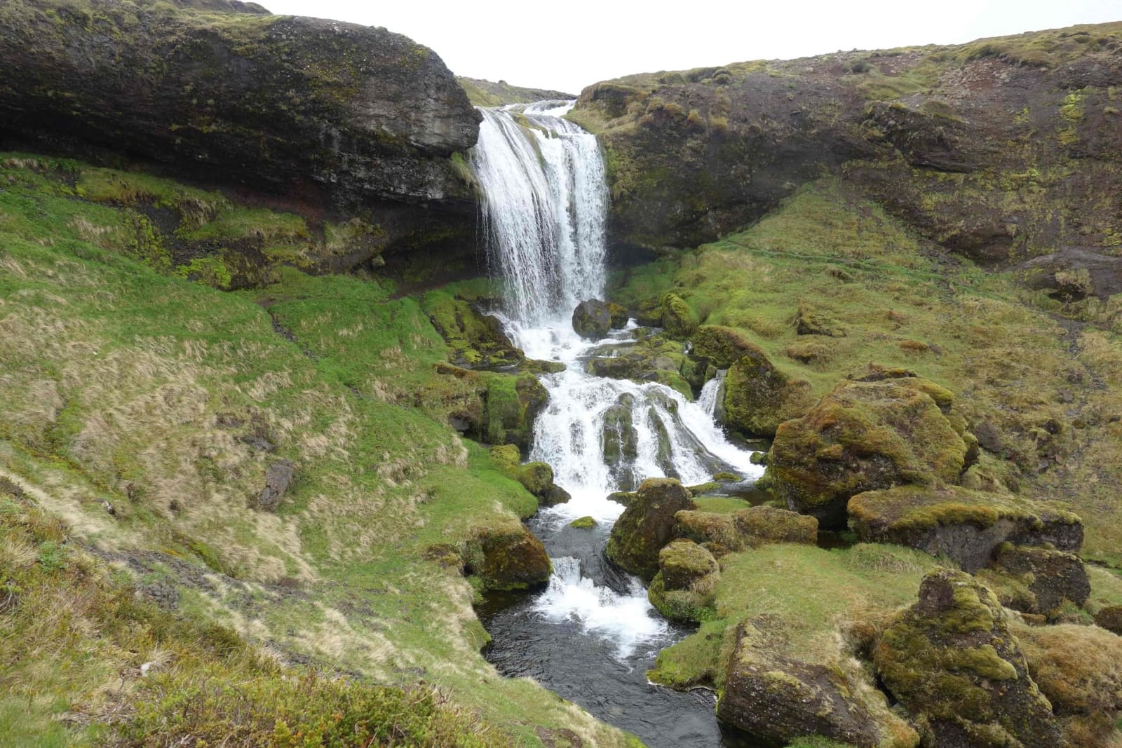 Selvallafoss cascades through a narrow green gully below Road 56 on Snæfellsnes.