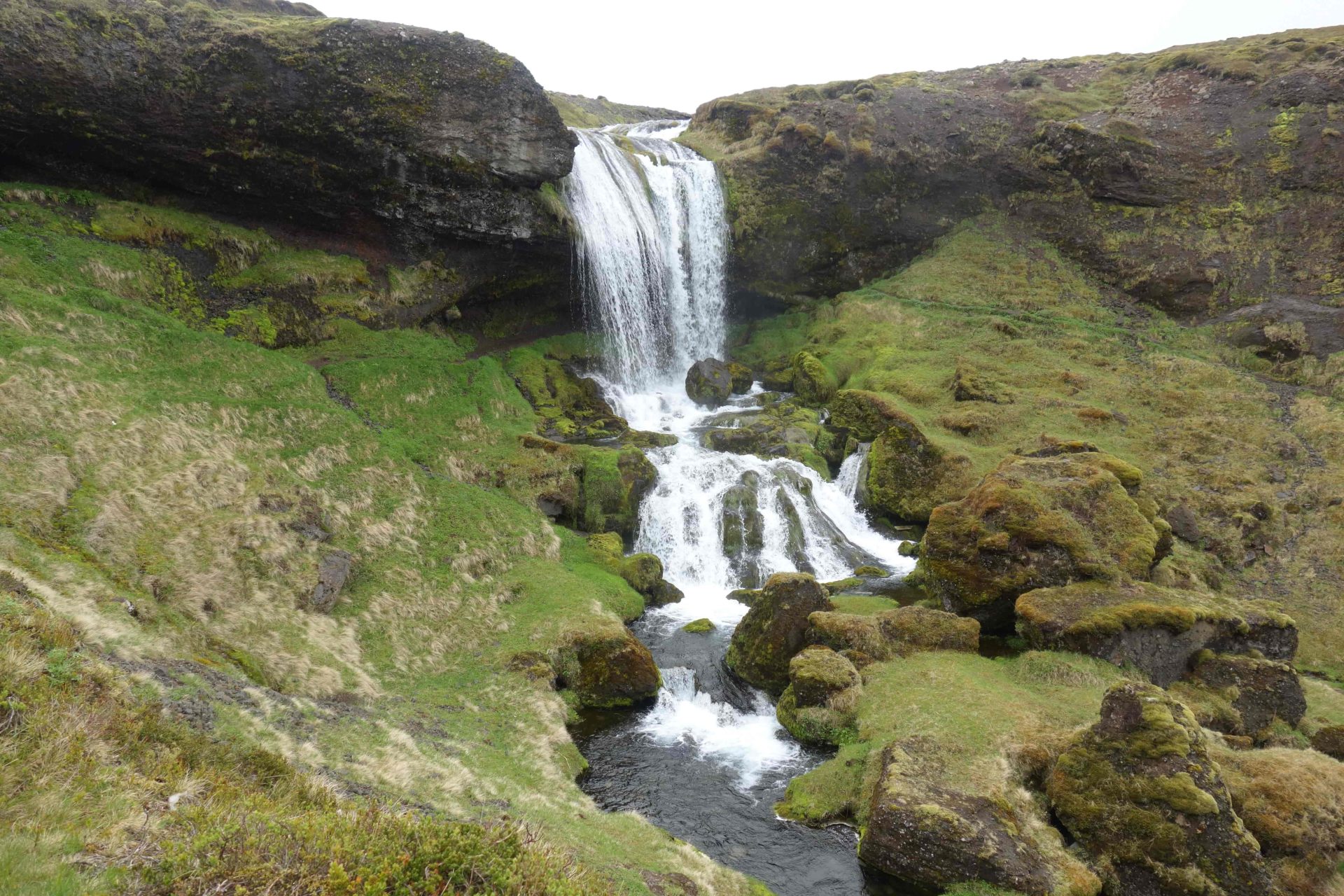 Selvallafoss cascades through a narrow green gully below Road 56 on Snæfellsnes.