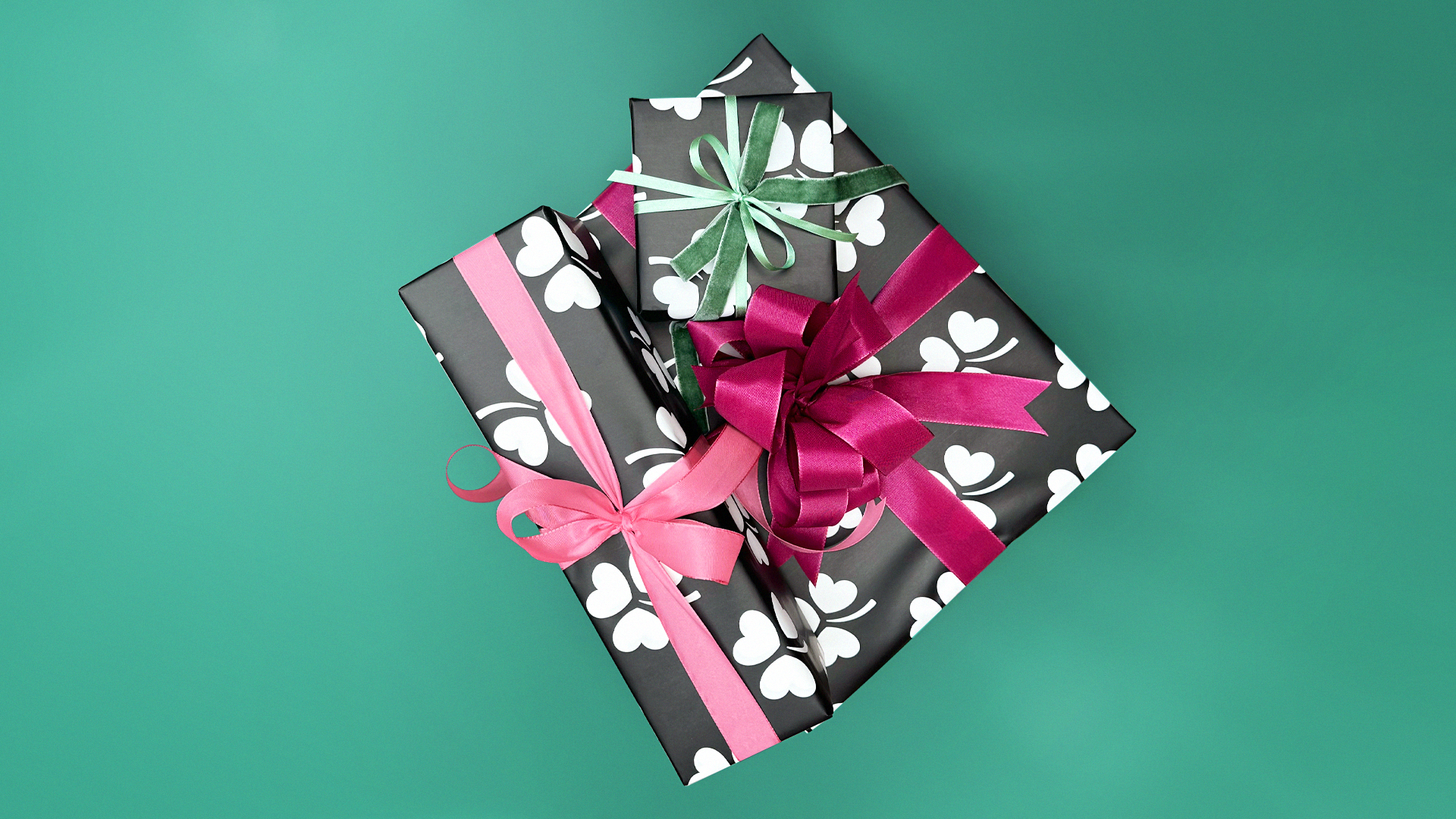 Wrapped package on a green surface from Smáralind service imagery.