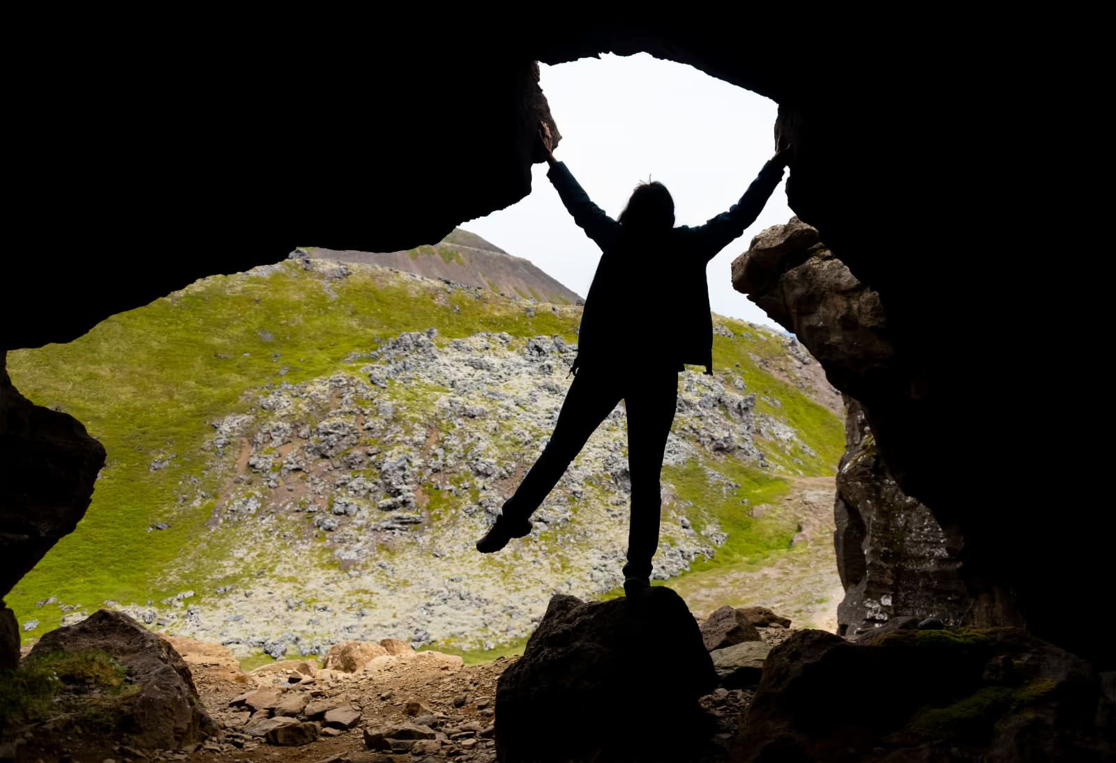 View from inside Sönghellir Cave toward the rocky Snæfellsnes slope outside.