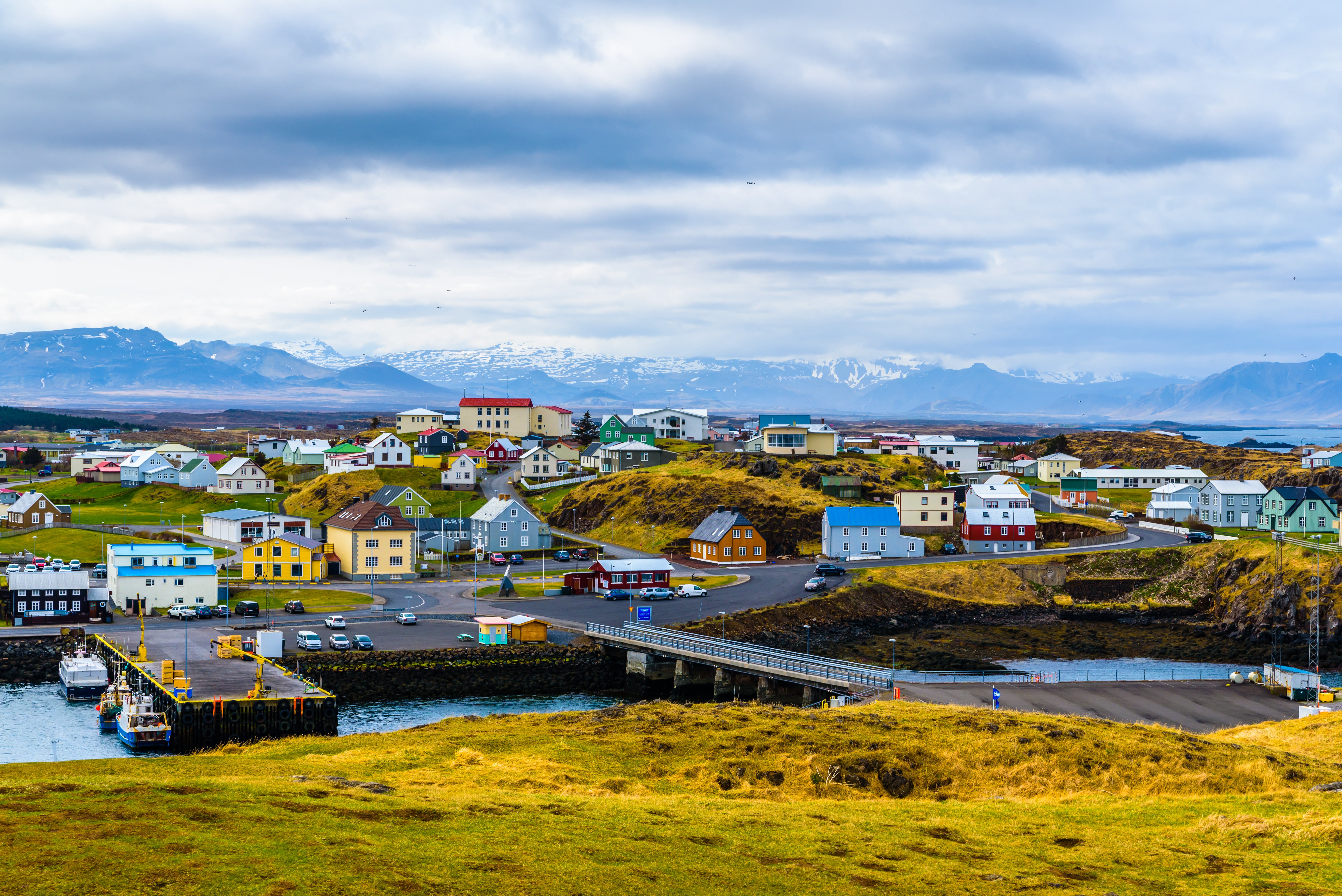 Colorful houses and harbor water in Stykkishólmur below the north Snæfellsnes mountains.