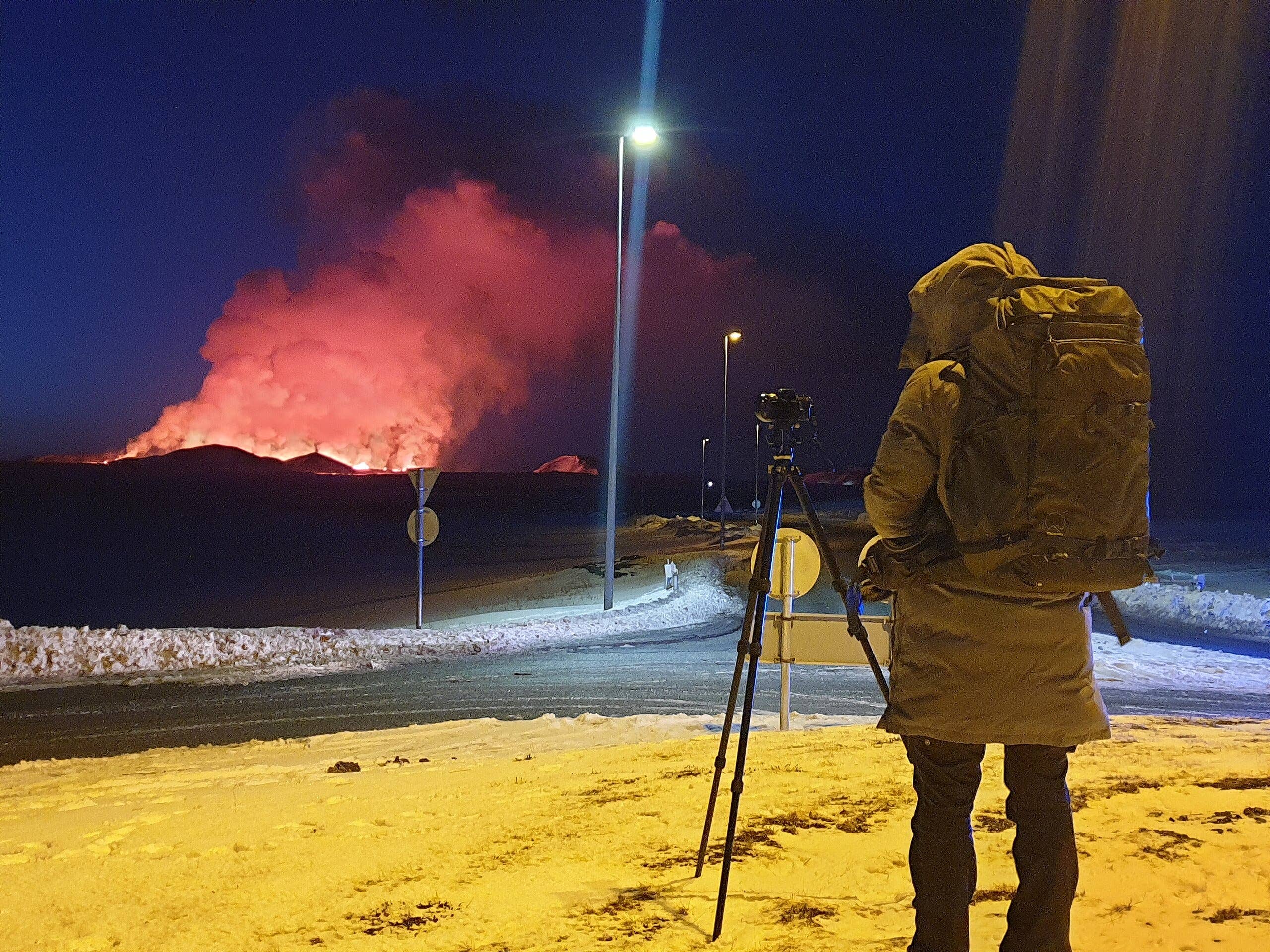 Distant view of a Sundhnúkagígar eruption seen across the Reykjanes landscape.