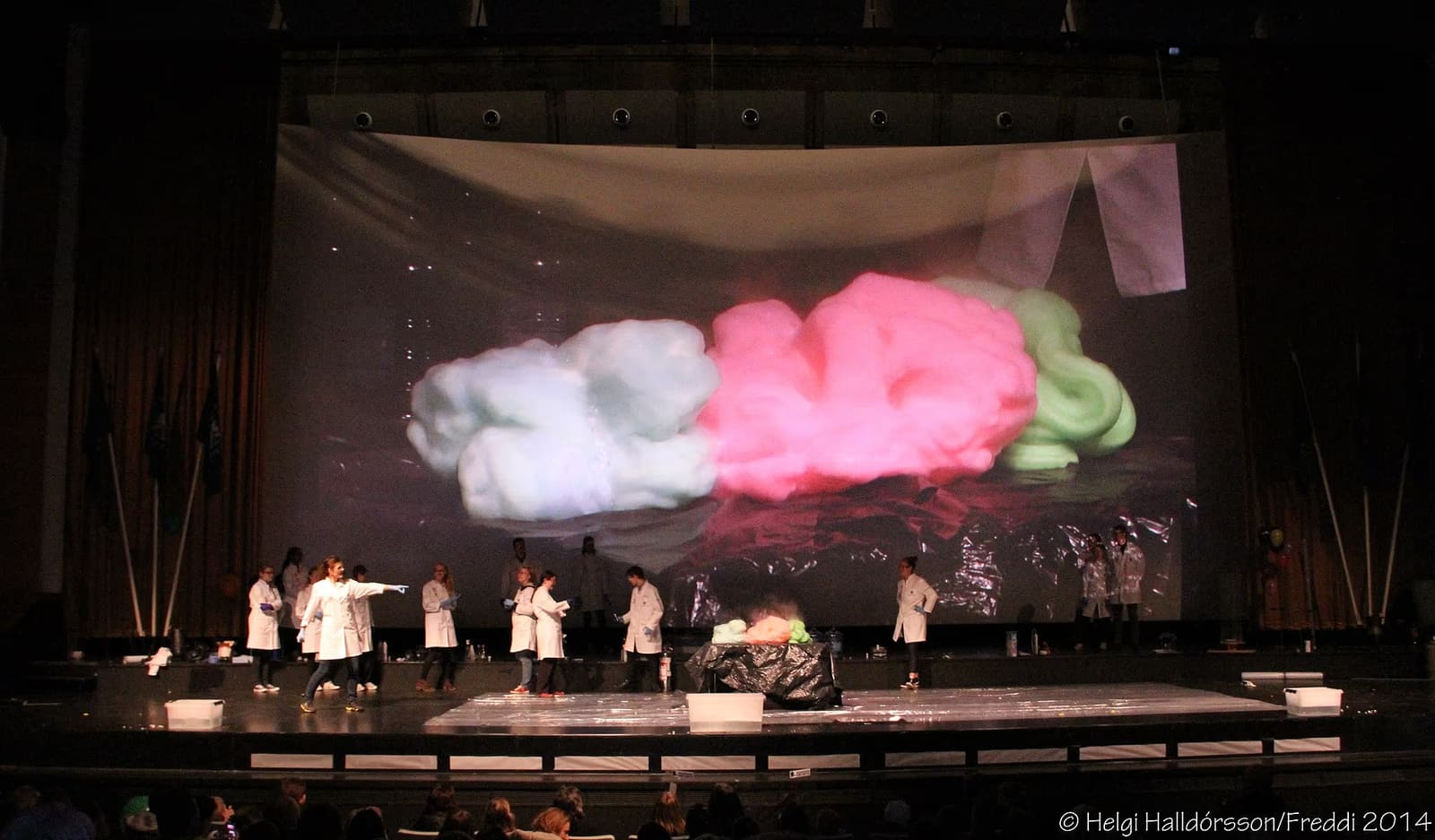 Actors performing on stage at the National Theatre of Iceland.