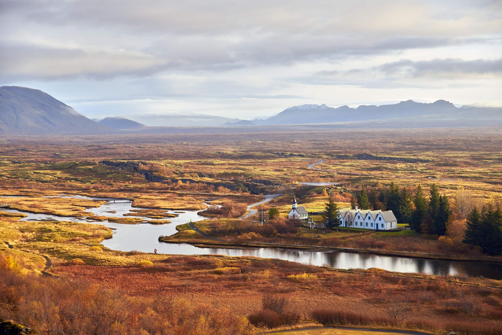 Autumn aerial view of Þingvallakirkja, Þingvallabær, Þingvallavatn, and the Þingvellir valley.