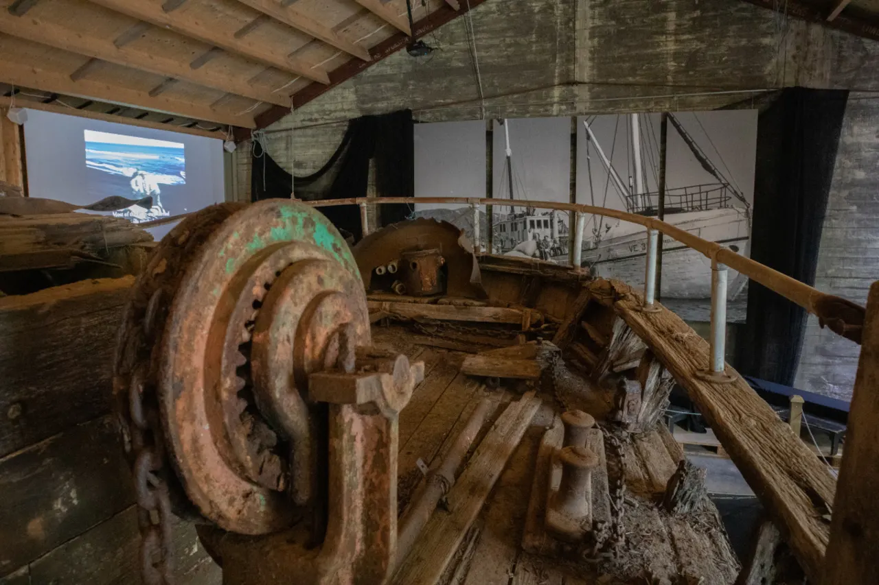 Deck details of the Skaftfellingur vessel with historical display panels and film projection behind.