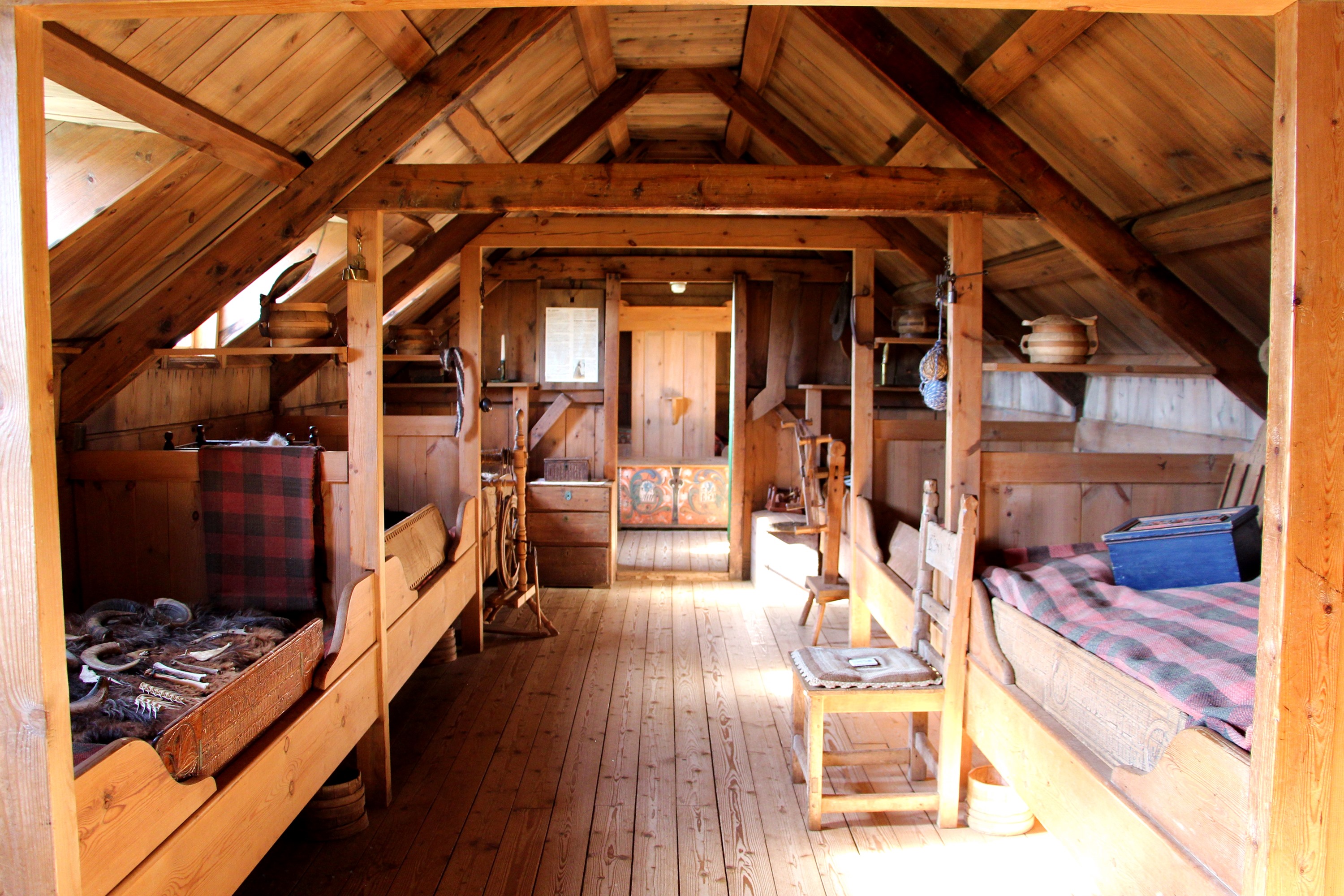 Wooden sleeping and storage interior in a Skagafjörður turf-house exhibition.