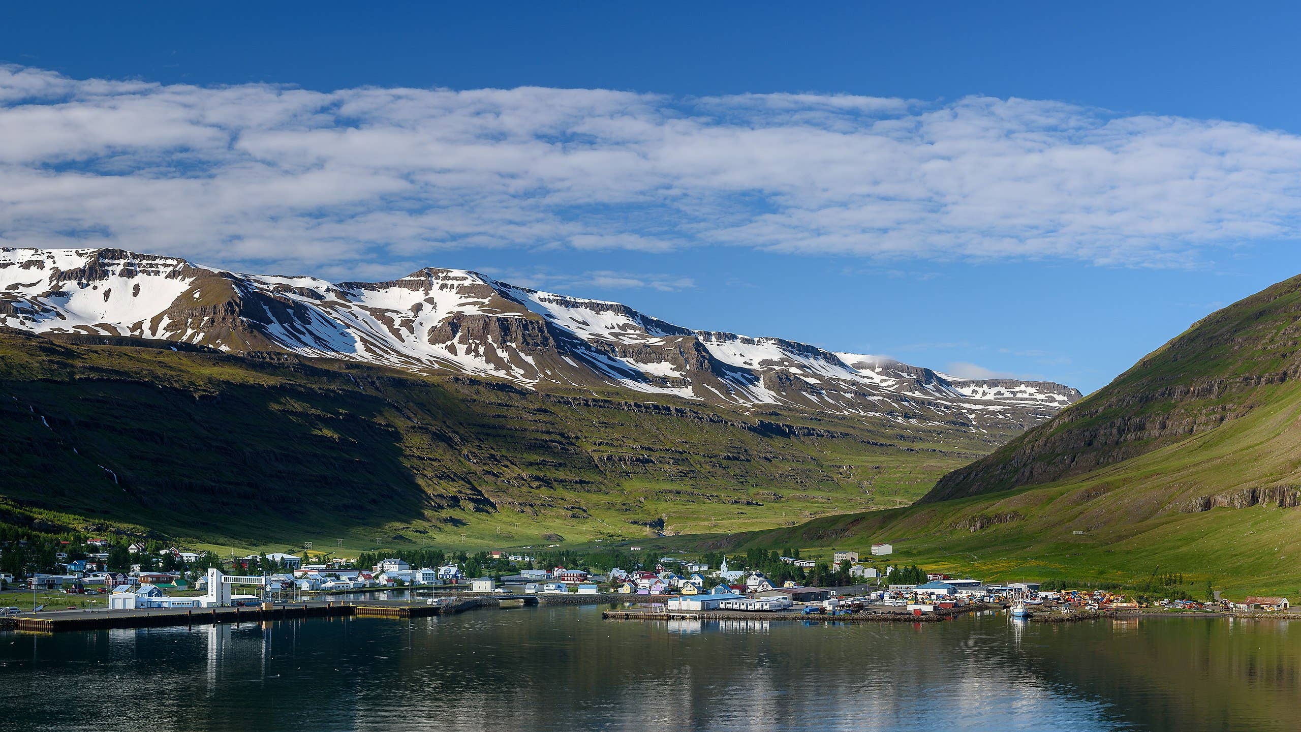 Seyðisfjörður fjord and town below steep Eastfjords mountains near the Vestdalsfossar area.