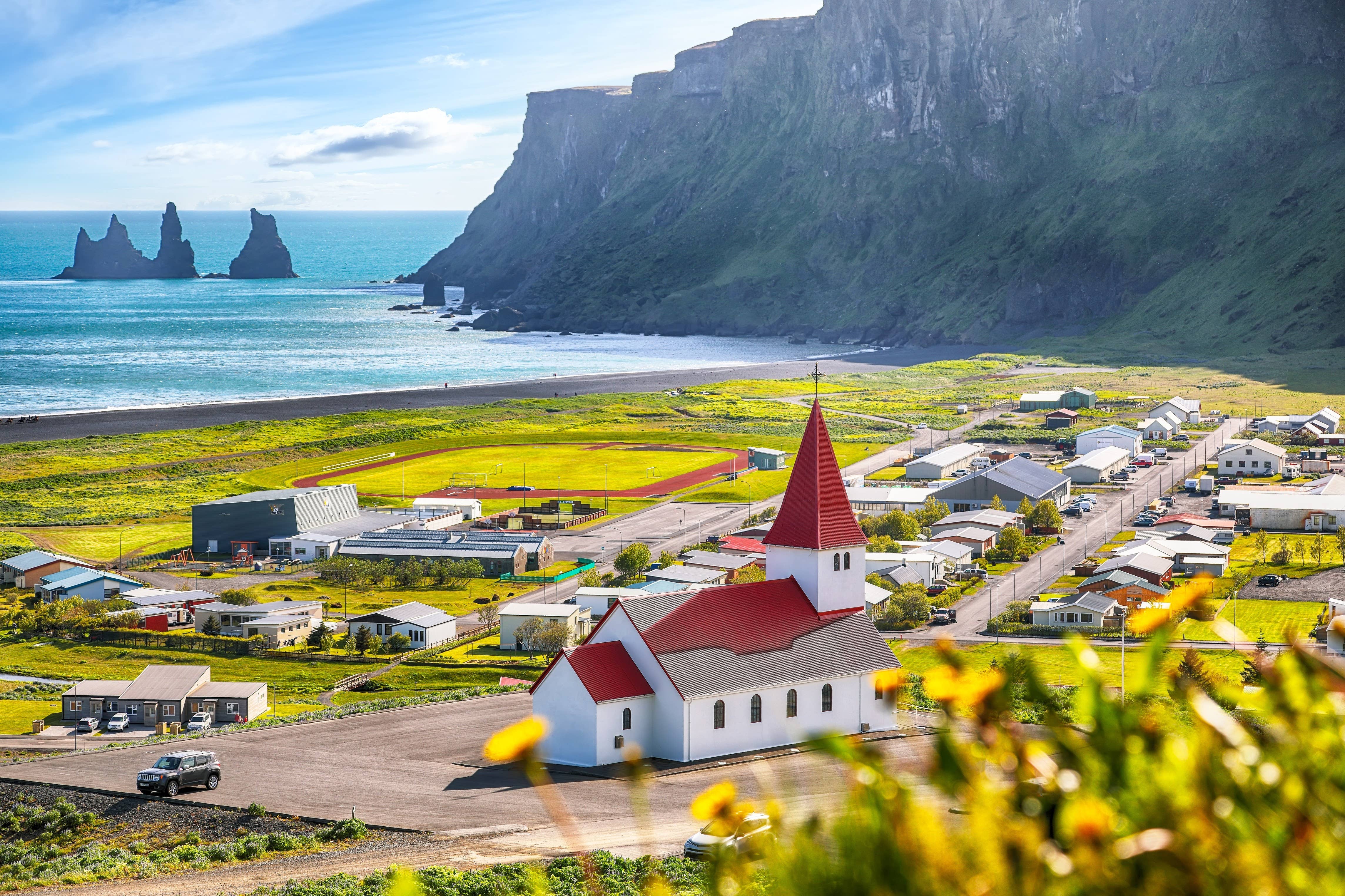 Víkurkirkja on its grassy hill above the South Coast village