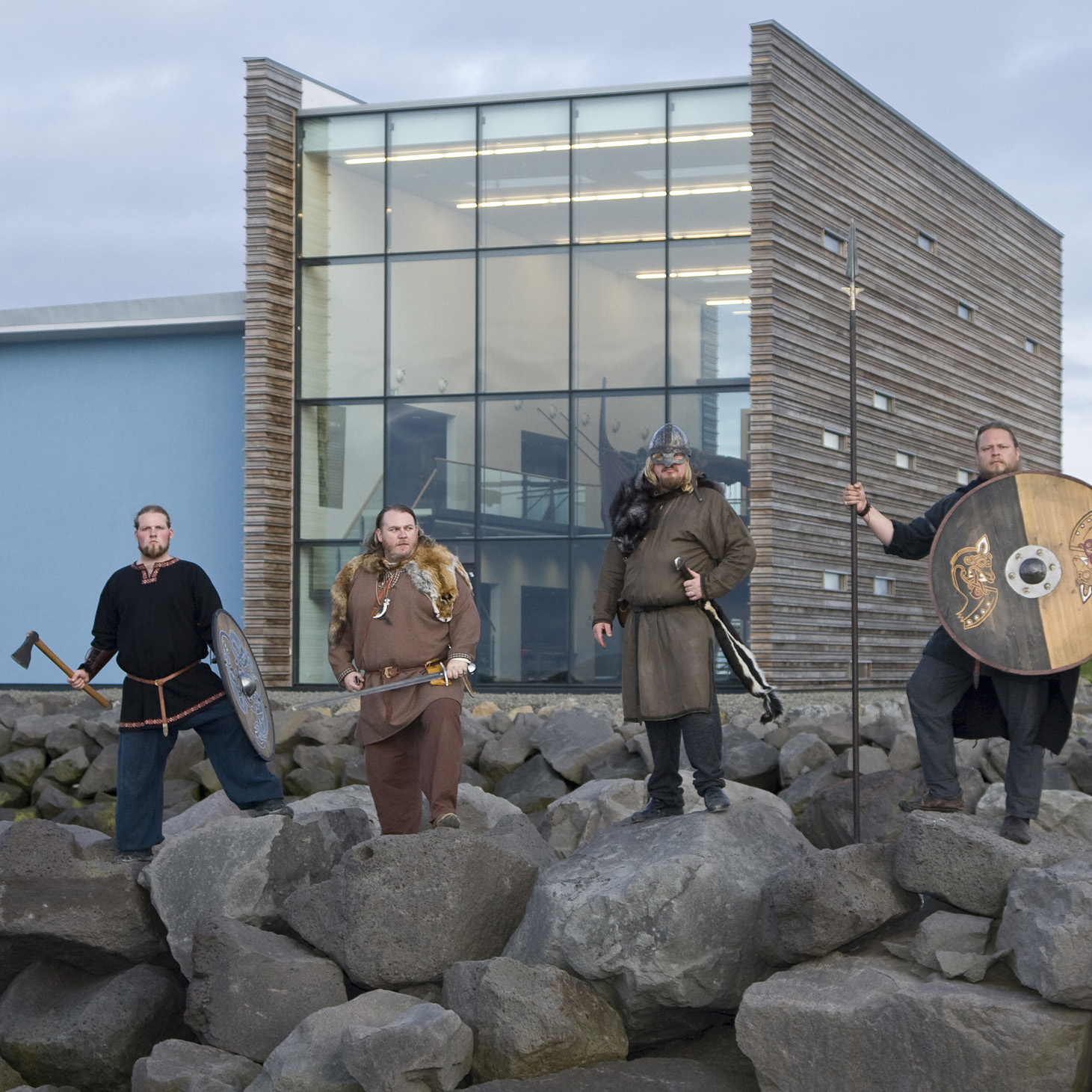 Visitors in Viking-style clothing outside Viking World in Reykjanesbær.