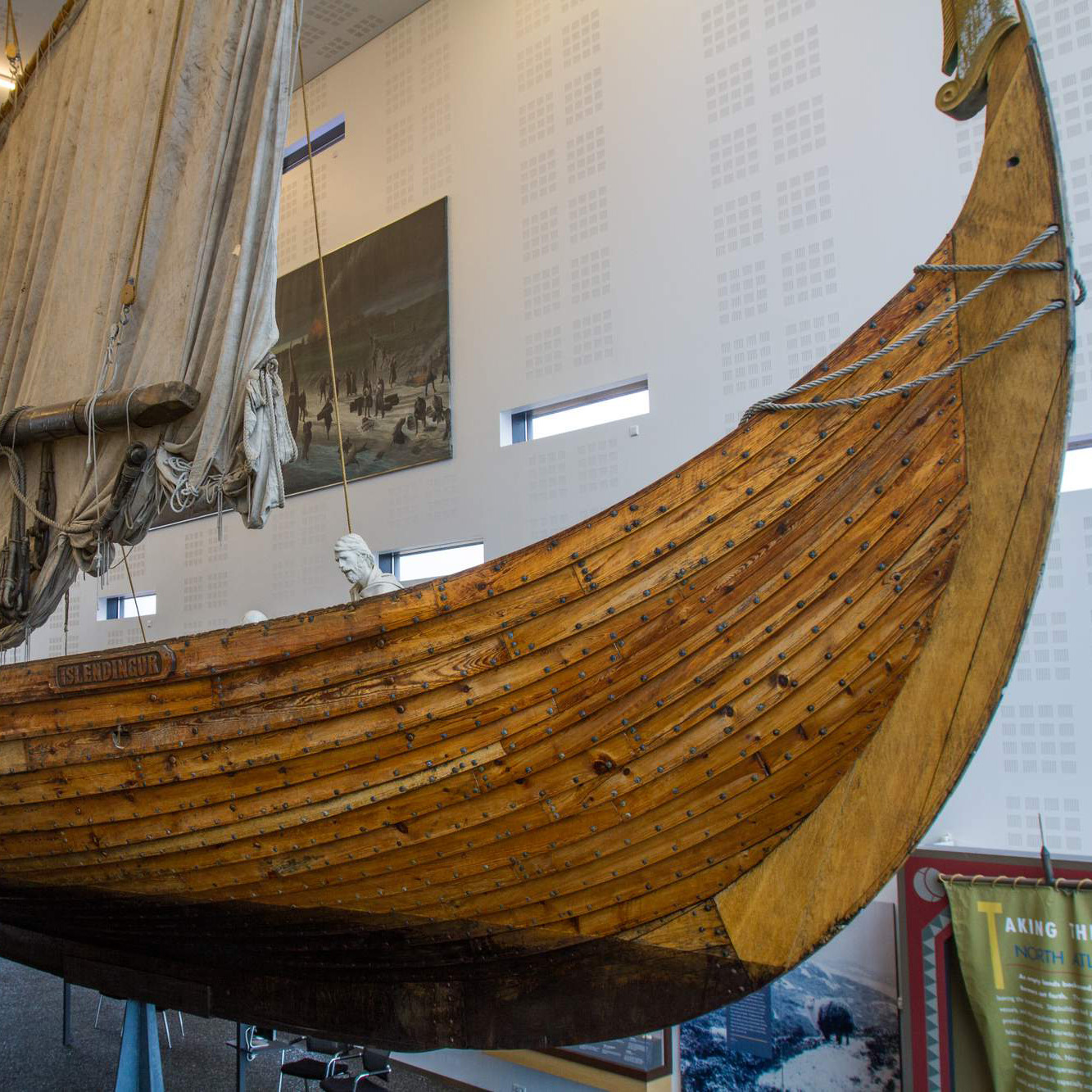 Side view of the Íslendingur ship replica inside Viking World.
