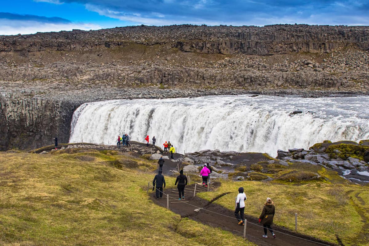 Visitors following the marked path toward Dettifoss in North Iceland