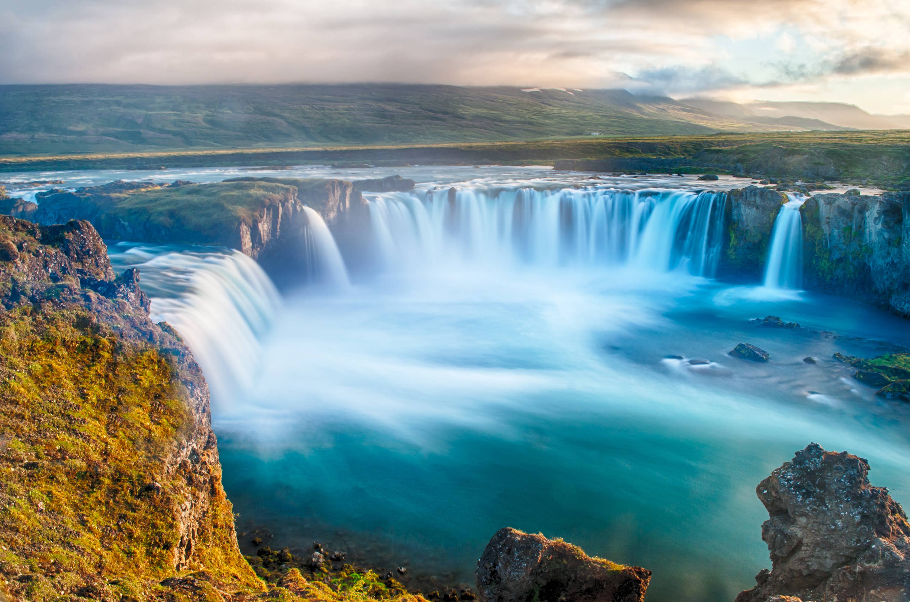 Wide summer view of Goðafoss waterfall on the western side of the Diamond Circle.