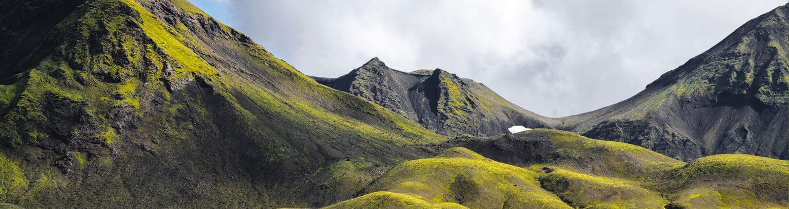 Wide view of moss-covered Highland mountains near Landmannalaugar