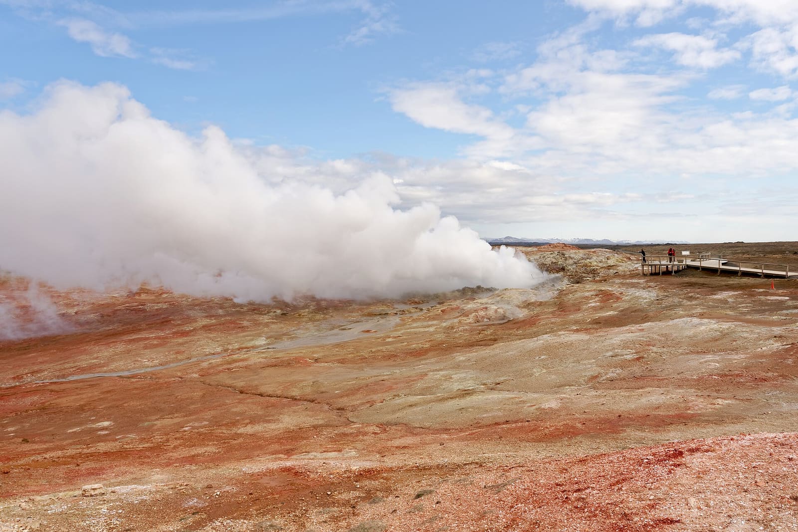 Steam rises from Gunnuhver beside marked viewing platforms on the Reykjanes Peninsula.