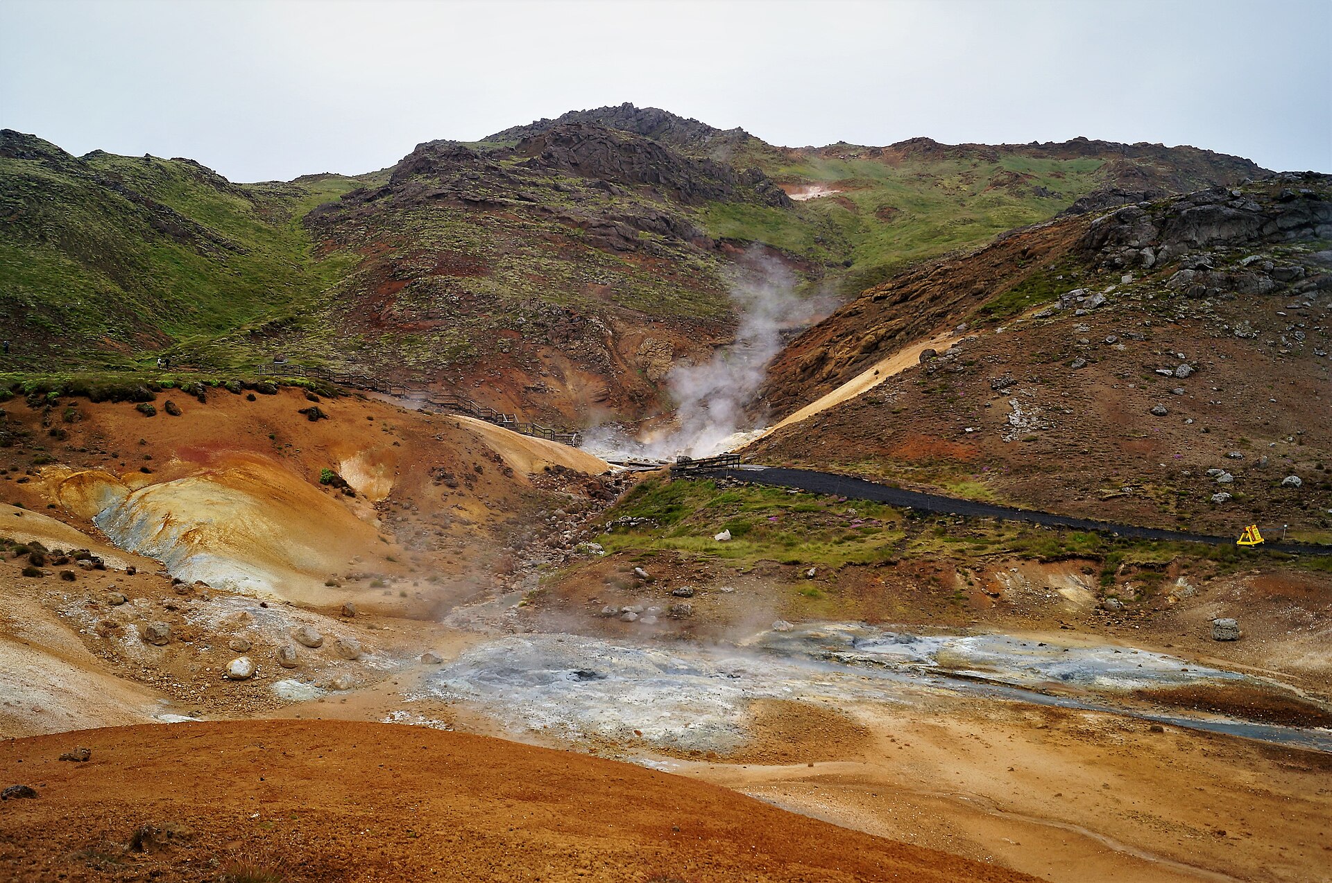 Boardwalks cross the steaming mineral slopes at Seltun in Krysuvik on Reykjanes.
