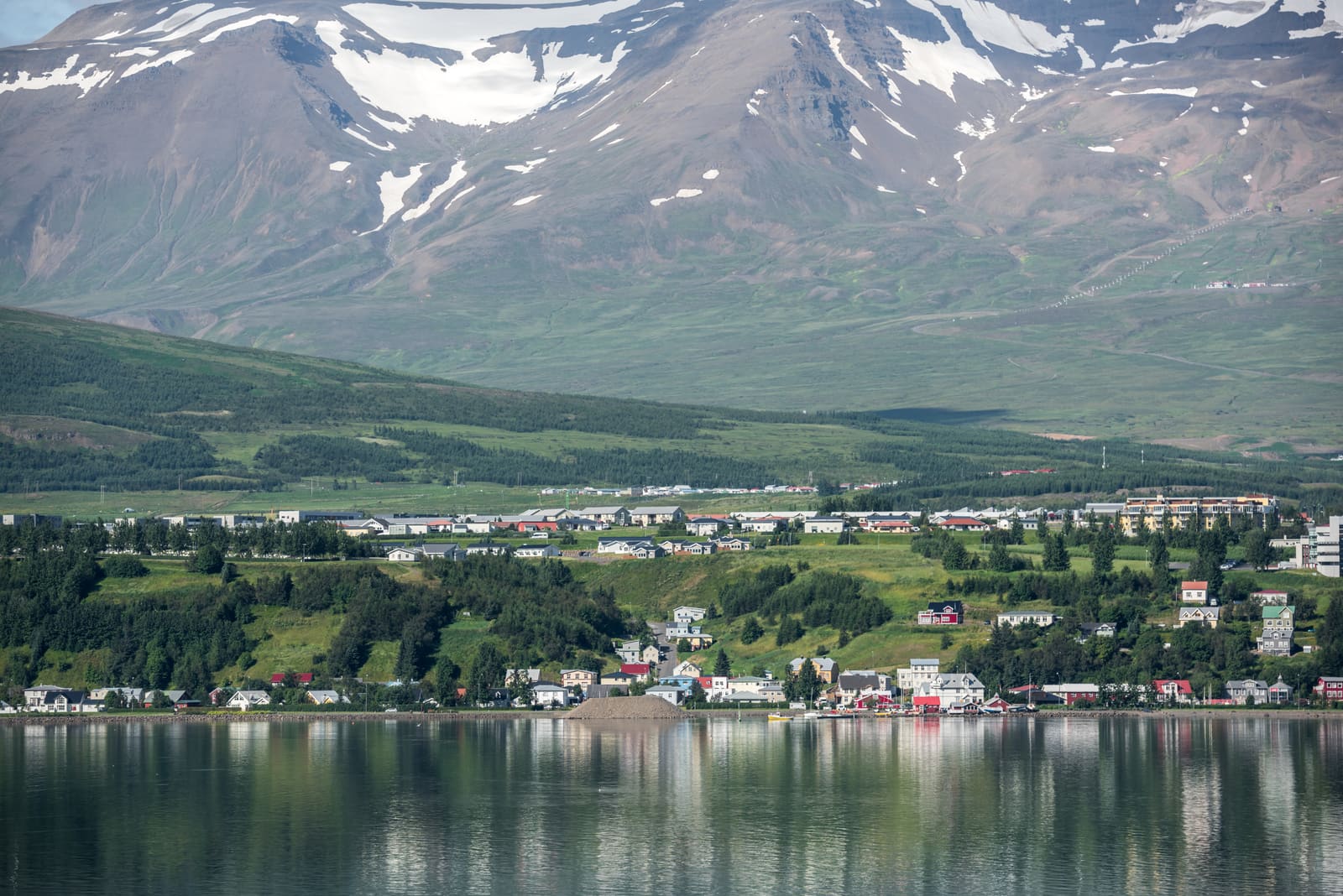 Akureyri across Eyjafjörður beneath snow-streaked mountains