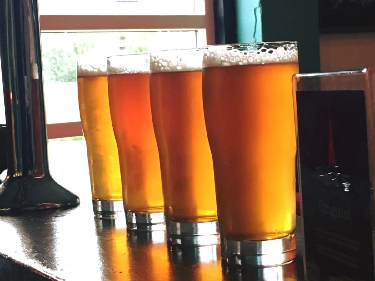 Five different beers arranged in a tasting flight at an Icelandic brewery