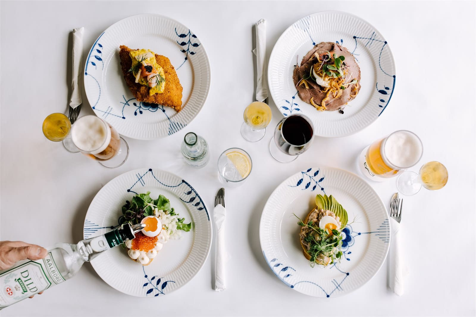 Several plated dishes and drinks on a restaurant table in Iceland