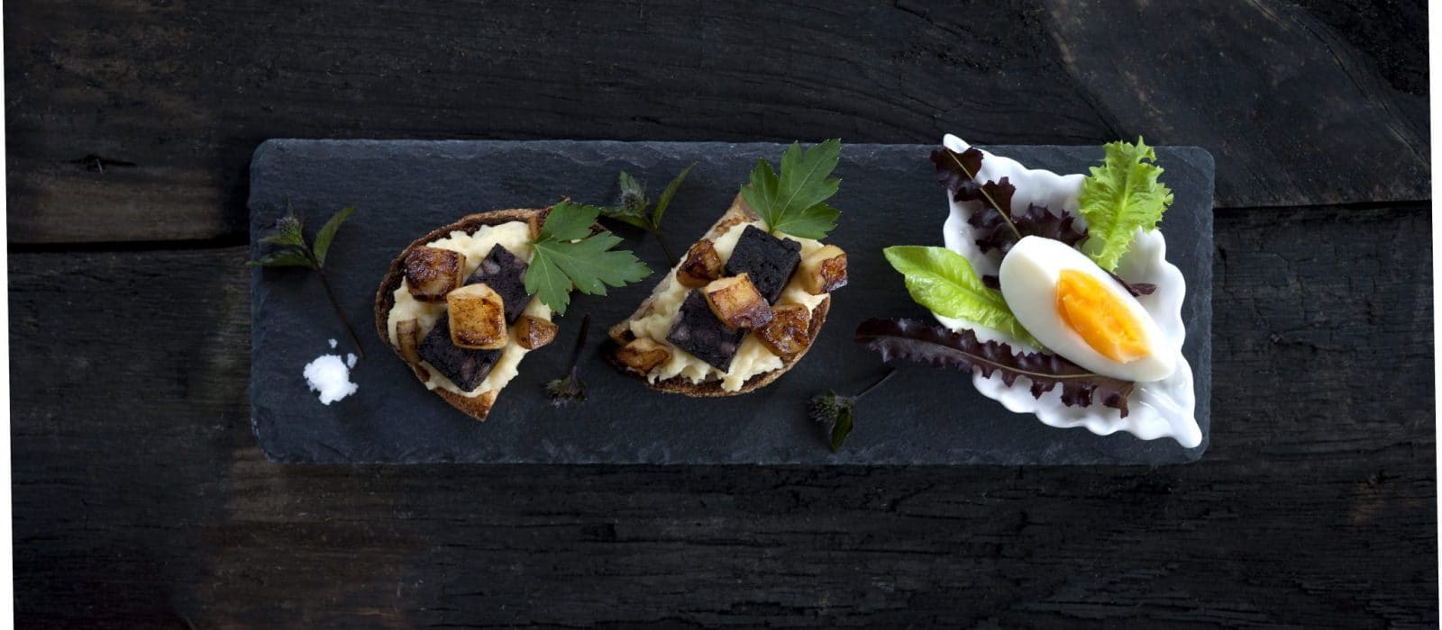 Icelandic bread and traditional ingredients arranged as a food culture tasting plate