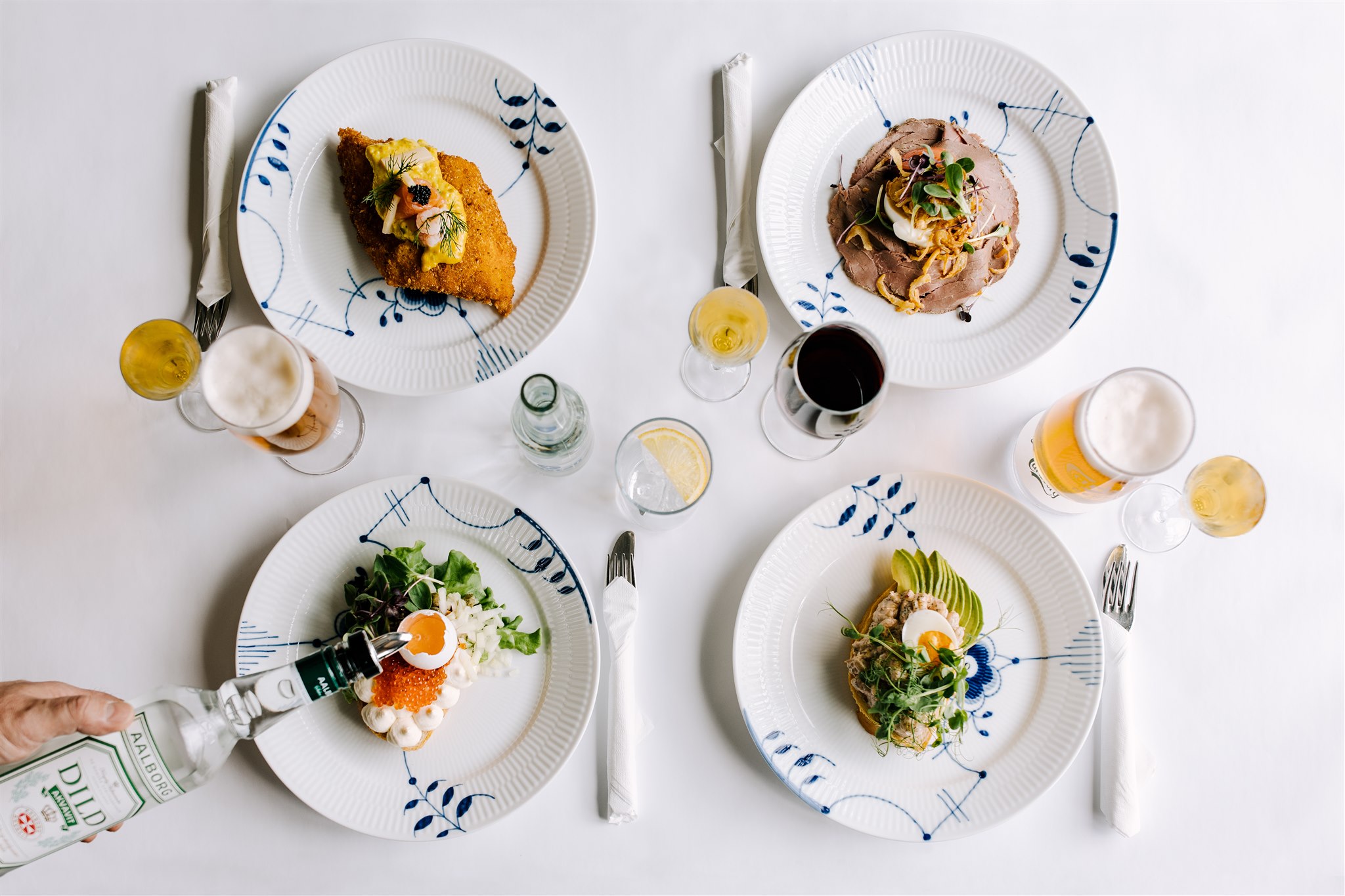 Several plated dishes and drinks on a restaurant table in Iceland
