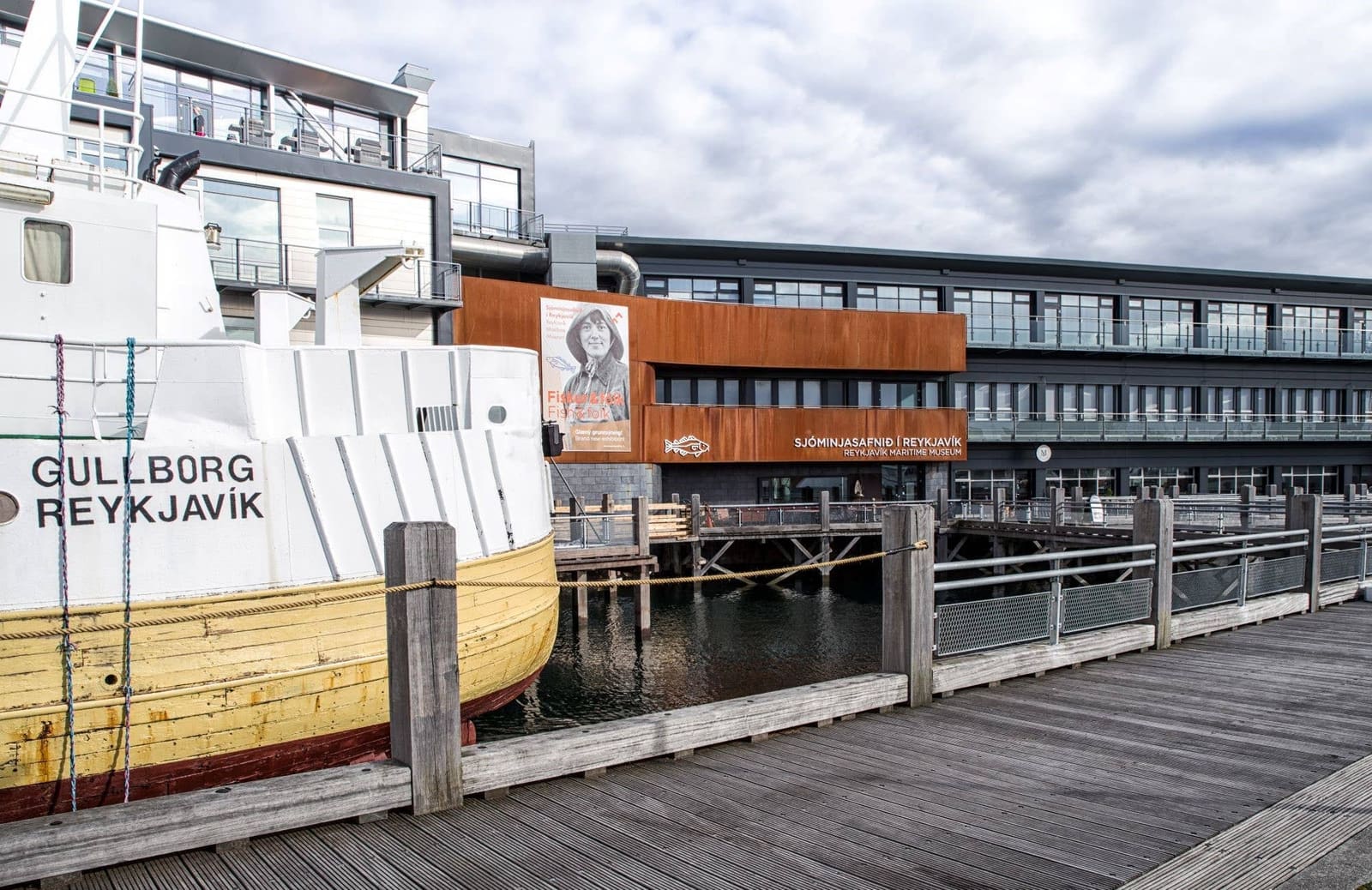 Reykjavik harbor boardwalk beside the Maritime Museum and a moored boat