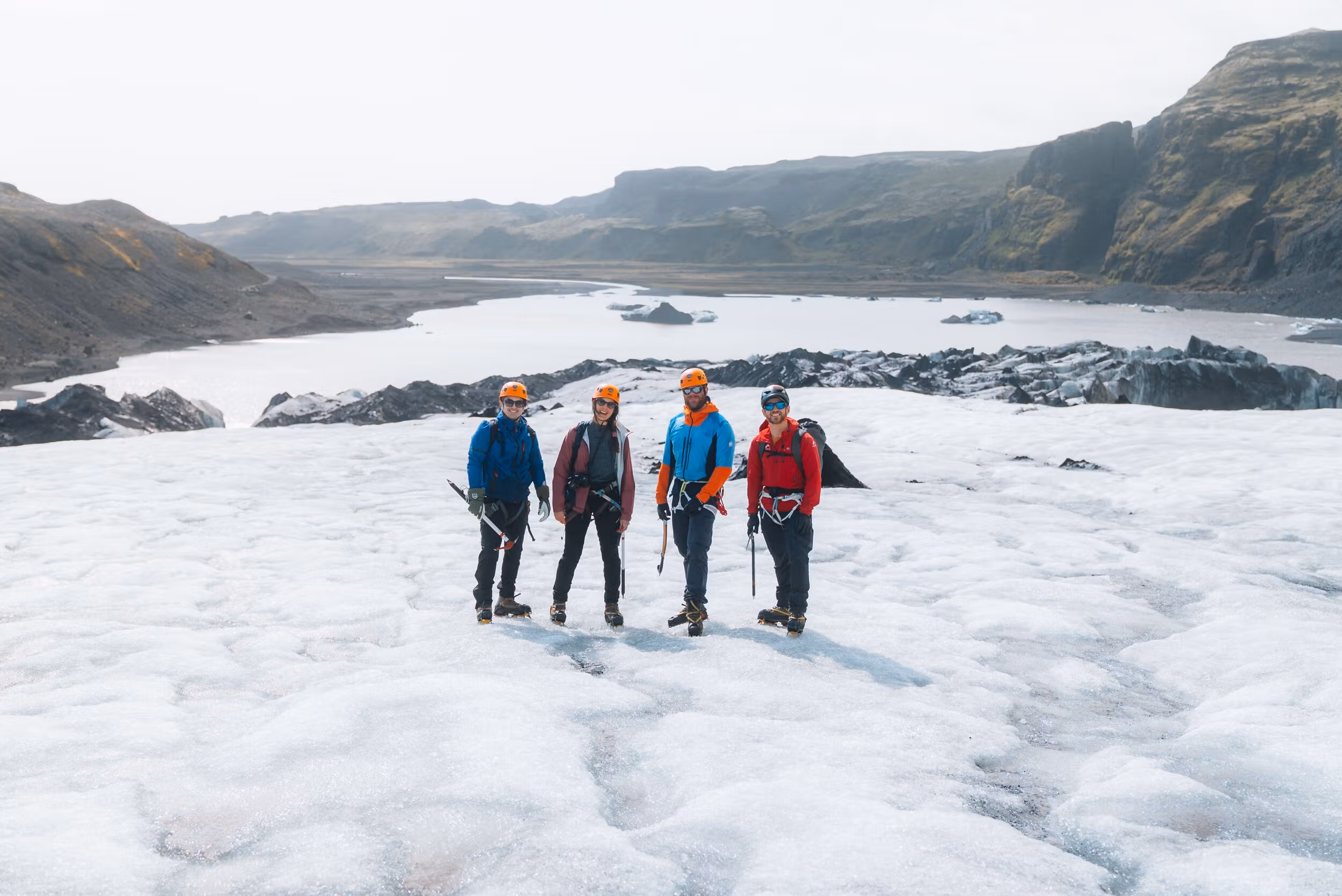 Hikers approaching Sólheimajökull during a South Coast glacier walk in Iceland.