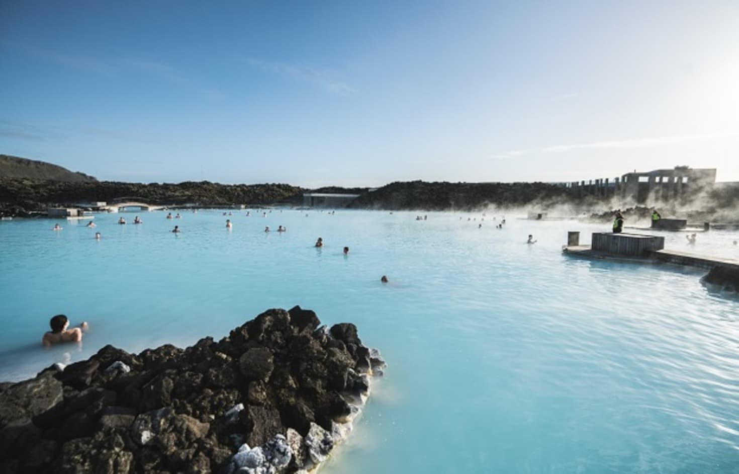 Blue geothermal lagoon water surrounded by black lava on the Reykjanes Peninsula