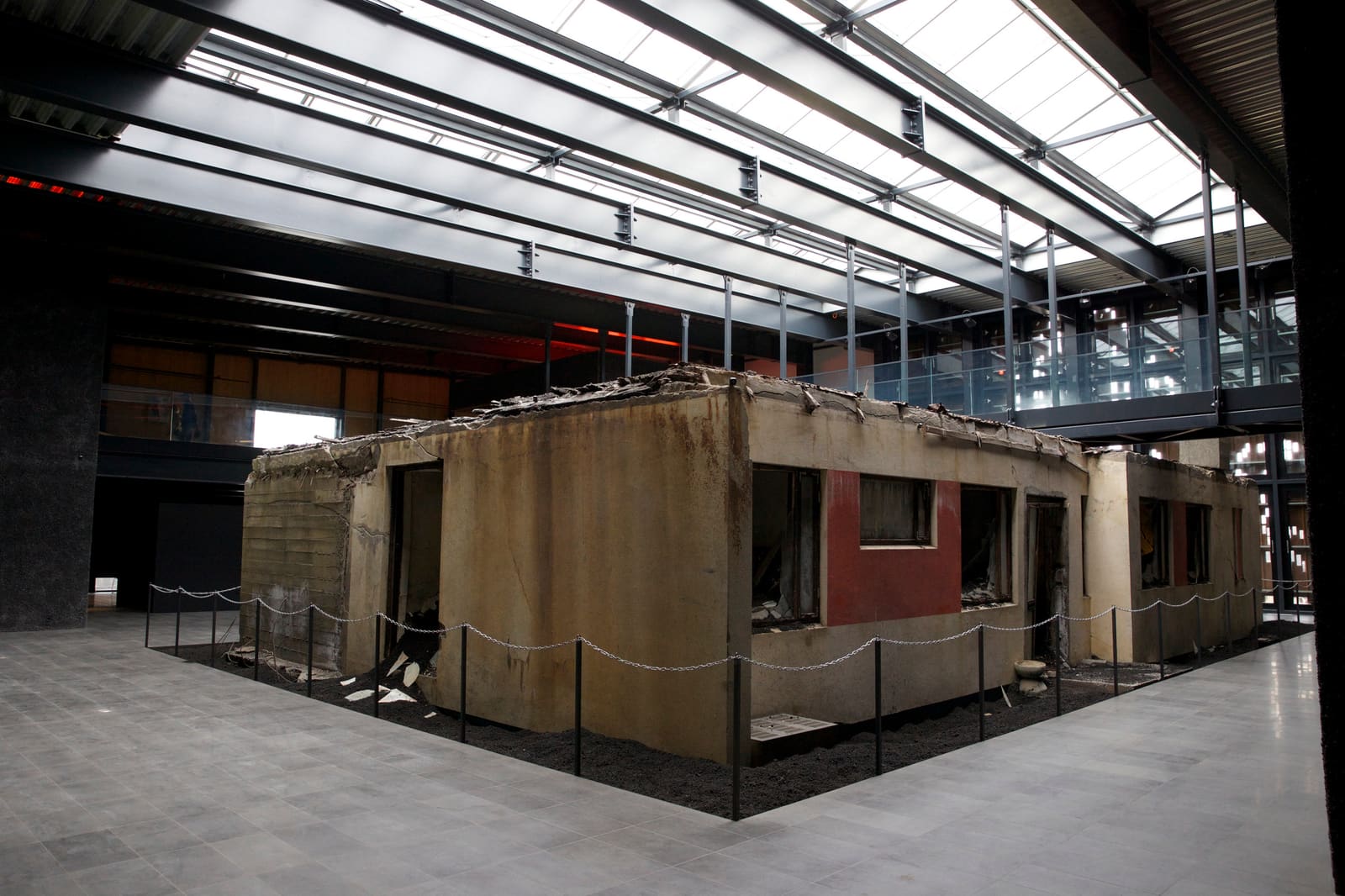 Preserved eruption-damaged house displayed inside Eldheimar museum on Heimaey