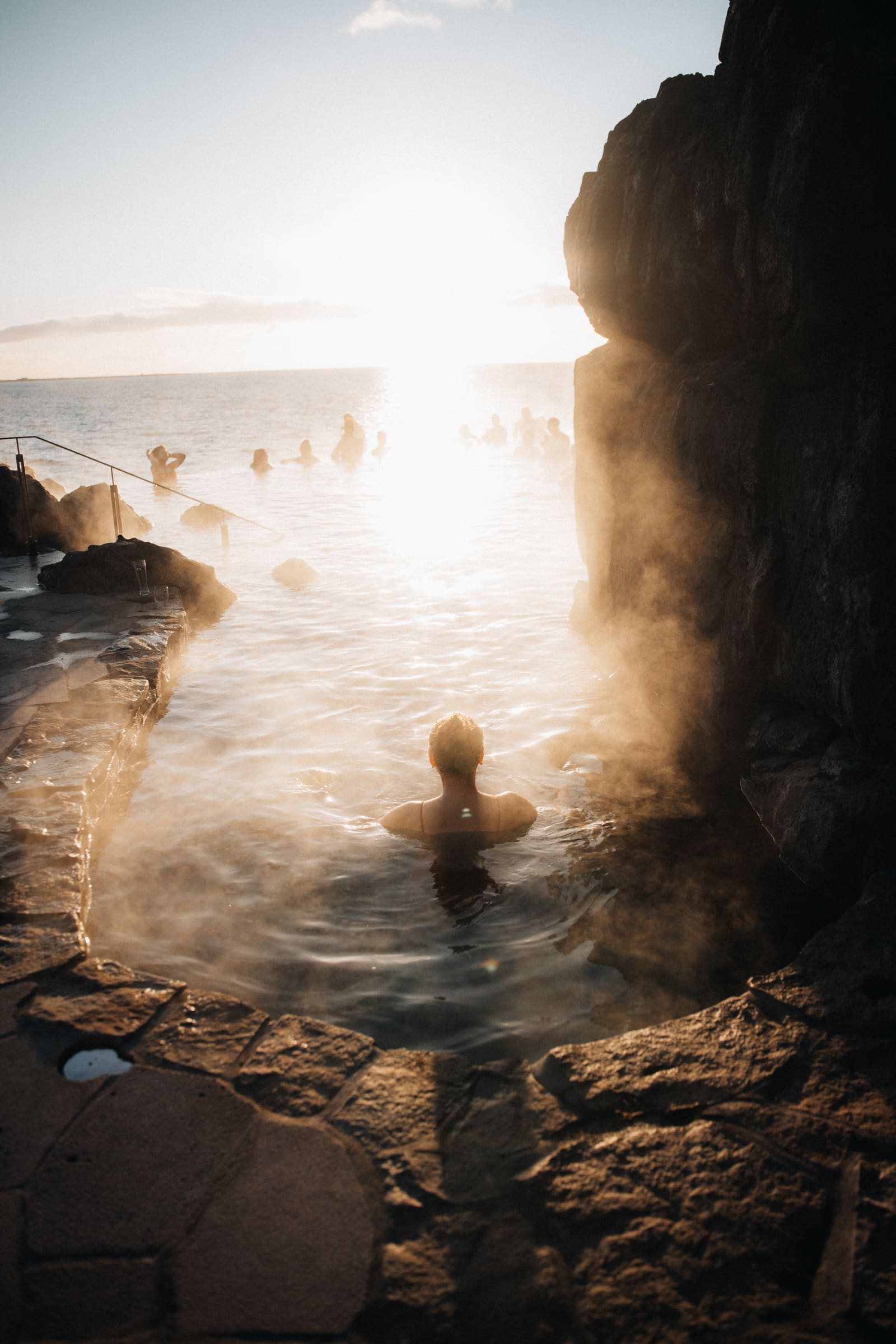 People bathing in steaming geothermal water near Reykjavík