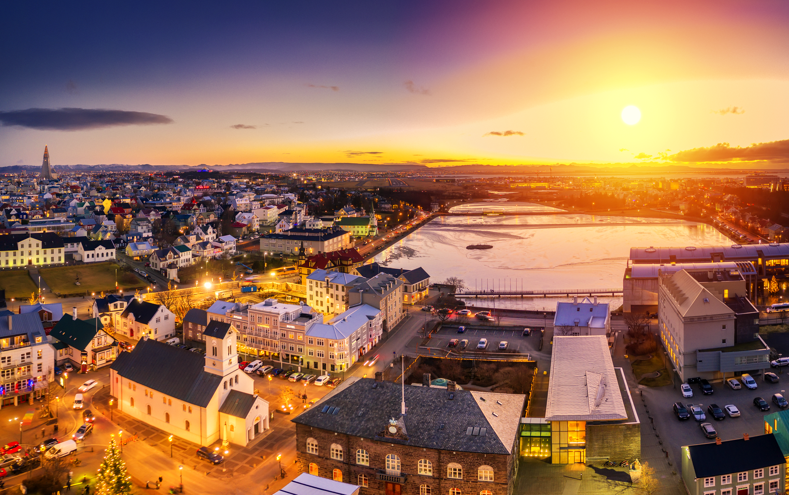Reykjavík city centre and Tjörnin lake under low evening light