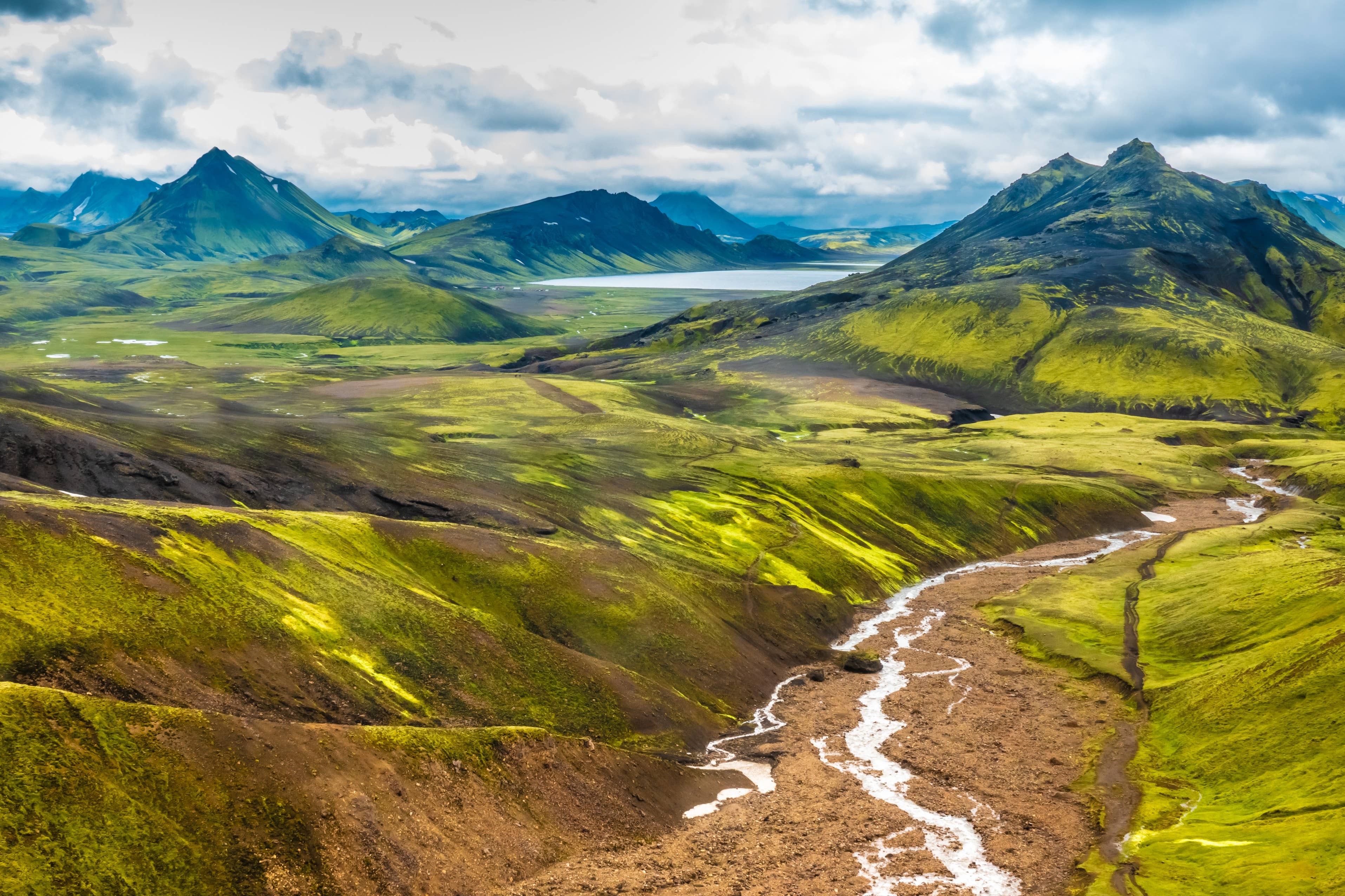 Green highland valley and lake along the Laugavegur route in summer.