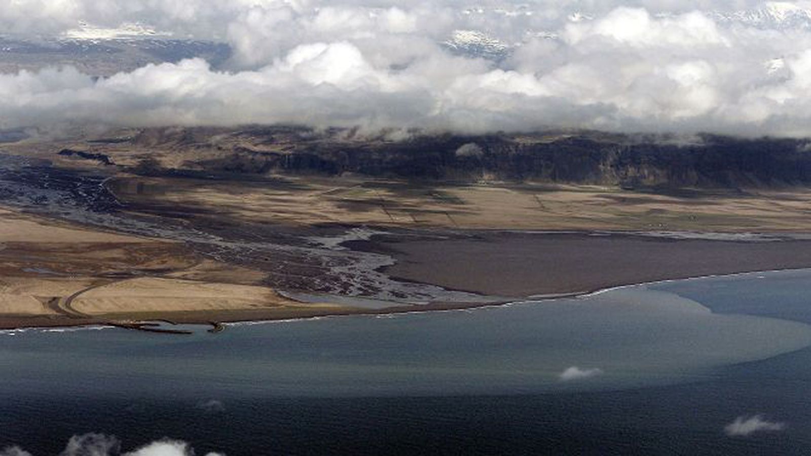 Aerial view across the lower Markarfljót river plain to Iceland's South Coast